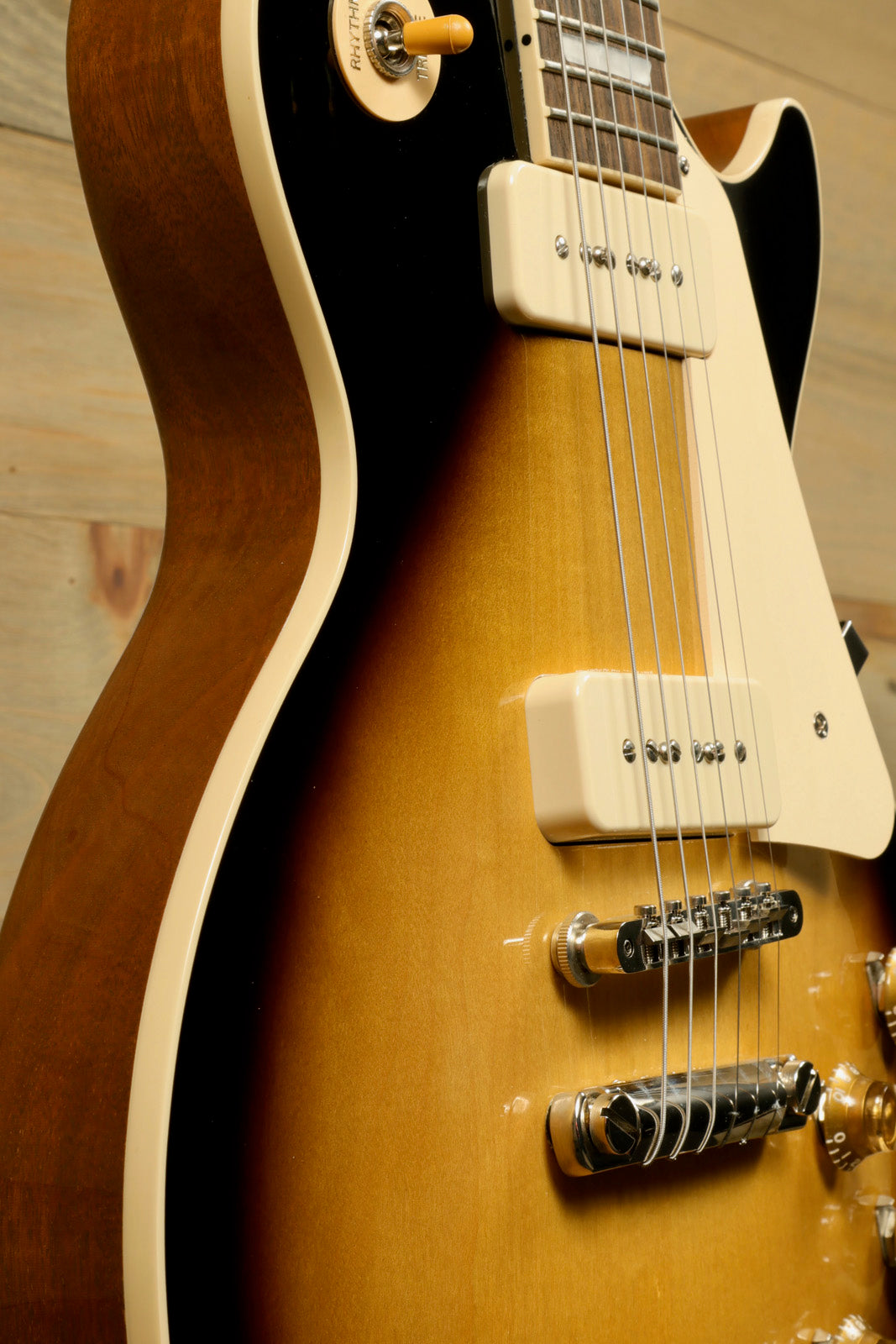 Gibson Les Paul Standard 50s P-90 in sunburst finish, side view showcasing classic design