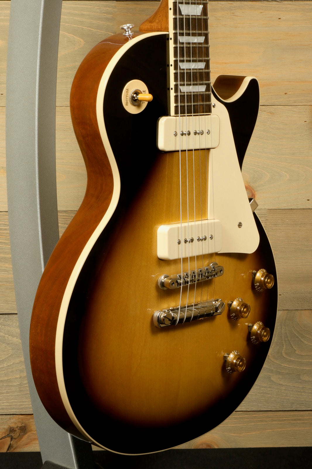 Gibson Les Paul Standard 50s P-90 in sunburst finish, side view showcasing elegant curves