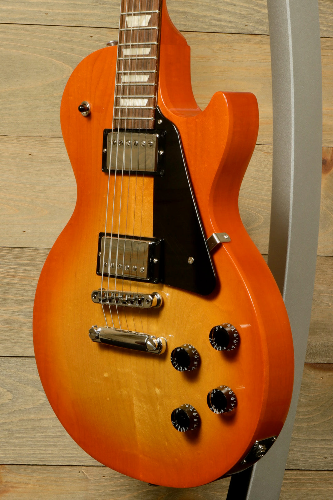 Gibson Les Paul Studio in sunburst finish, angled view showcasing hardware and body design