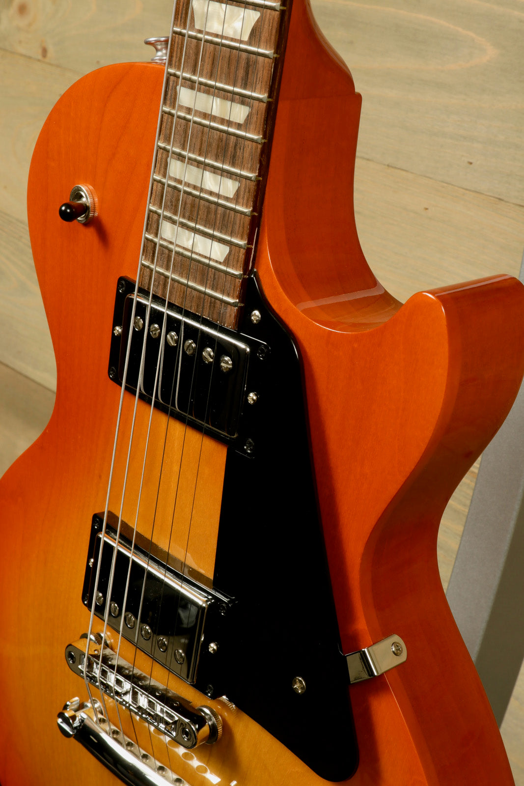 Gibson Les Paul Studio in sunburst finish, side view showcasing the body and pickups
