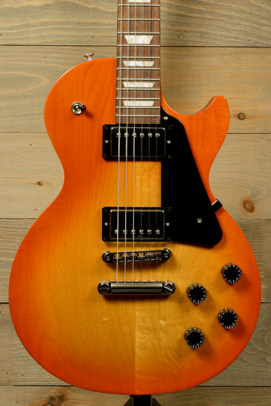 Gibson Les Paul Studio in an orange sunburst finish, front view showcasing the body and pickups