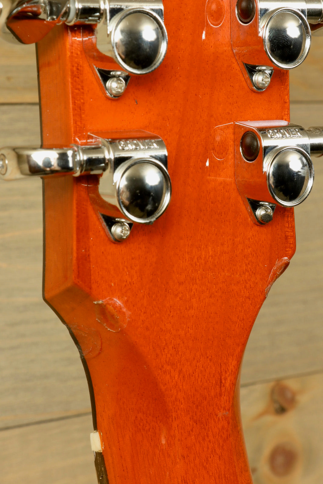 Gibson Les Paul Studio electric guitar with a stunning natural wood finish, rear view showcasing tuning pegs