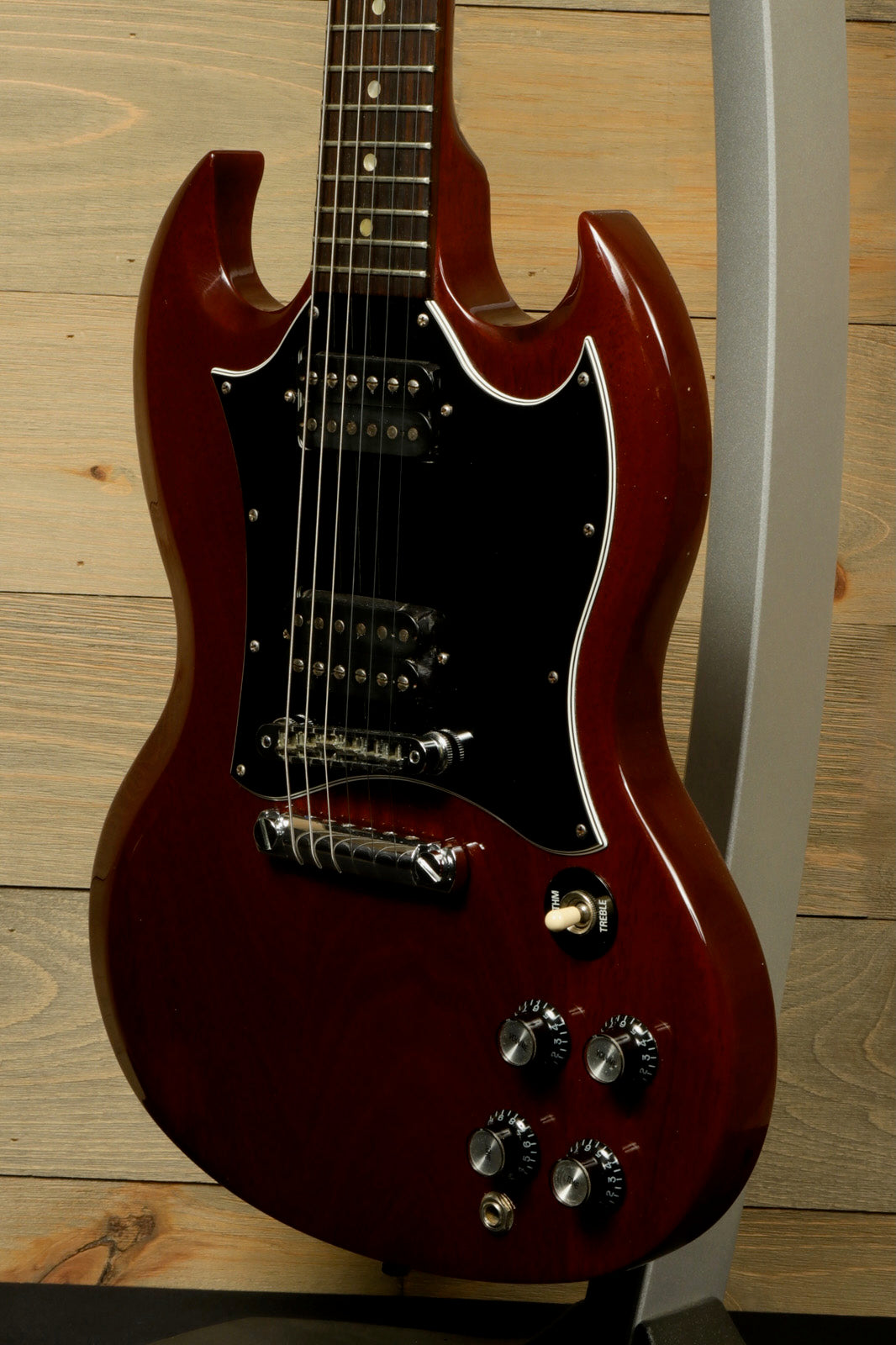 Gibson SG Special in vintage cherry finish, front view with black pickguard and control knobs