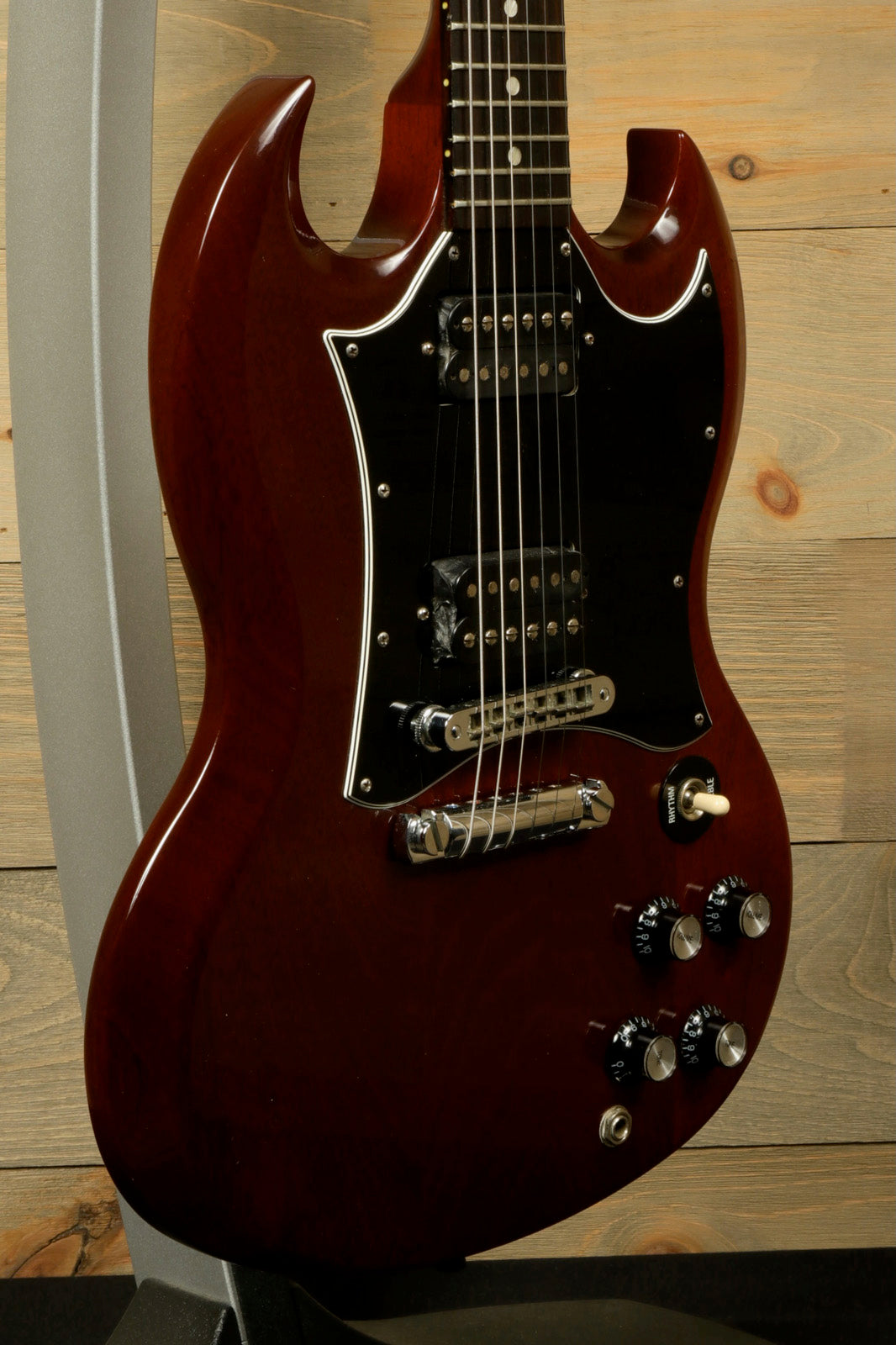 Gibson SG Special in worn cherry finish, close-up view showcasing its double-cutaway design