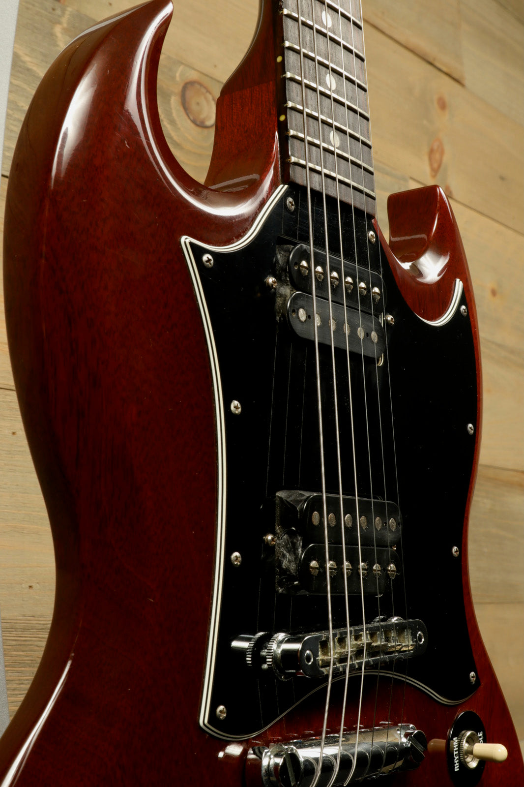 Gibson SG Special cherry red electric guitar, close-up view of body and neck