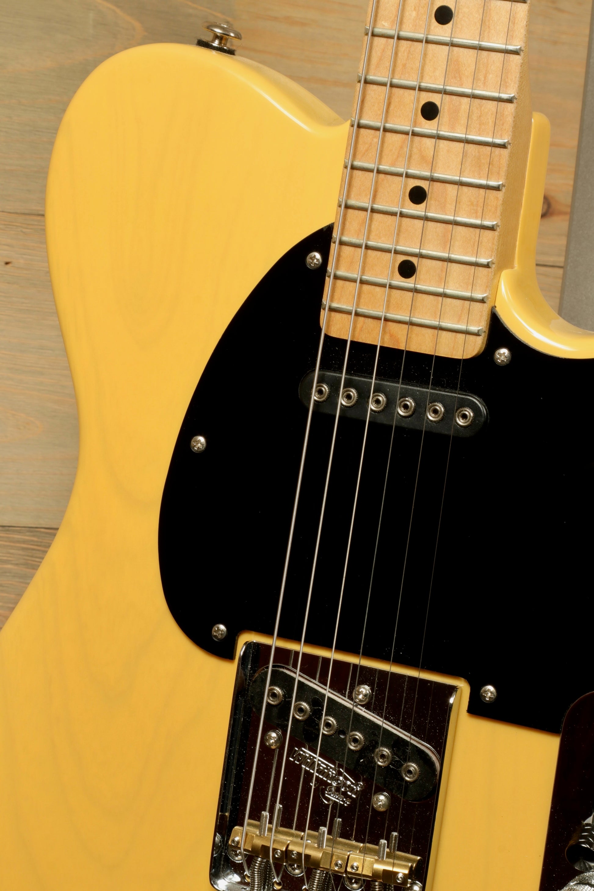 G&L 2016 ASAT Classic in yellow finish, front view with maple neck and black pickguard.