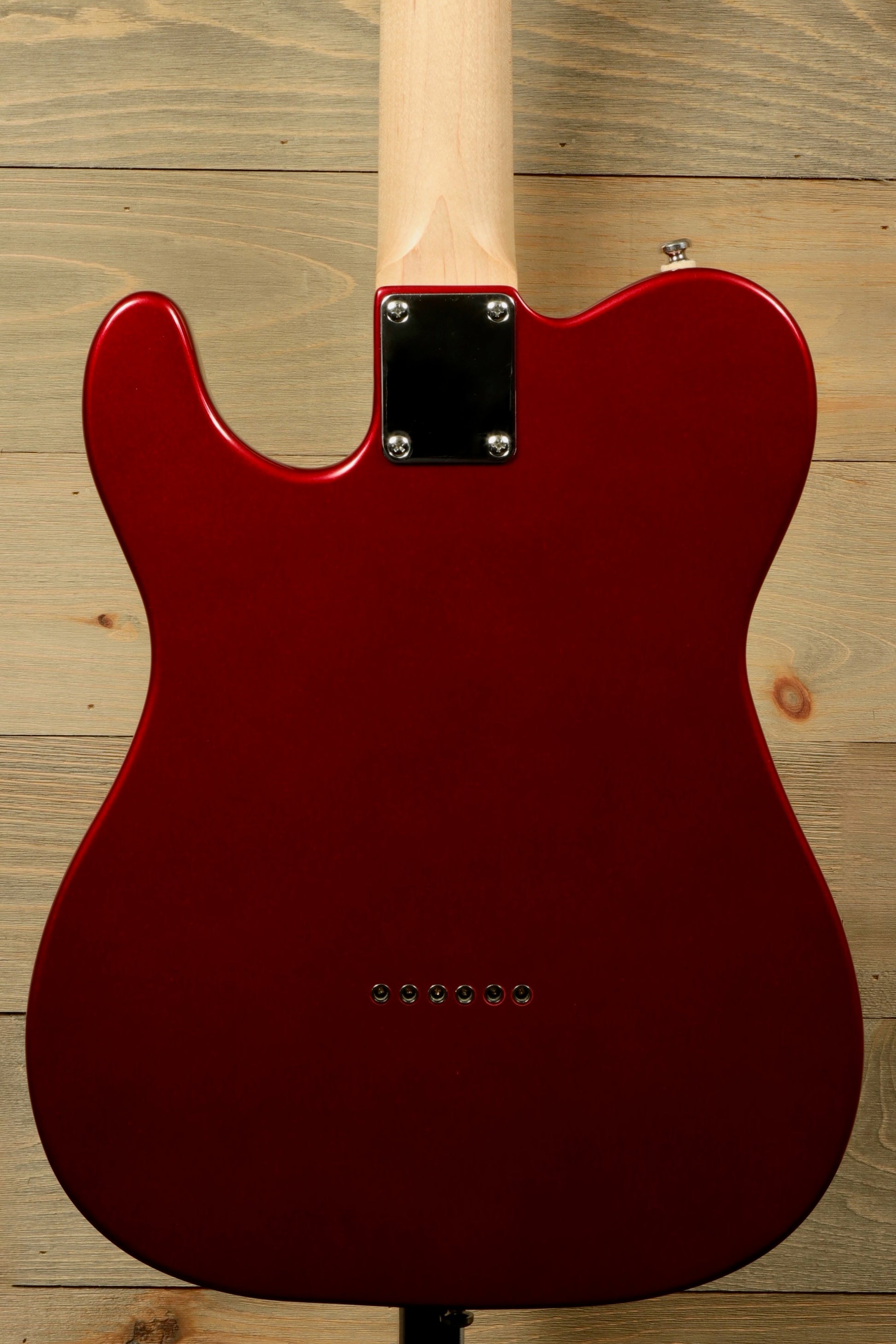 Back view of G&L Tribute ASAT Classic with G&L Gig Bag showcasing a sleek red finish and maple neck