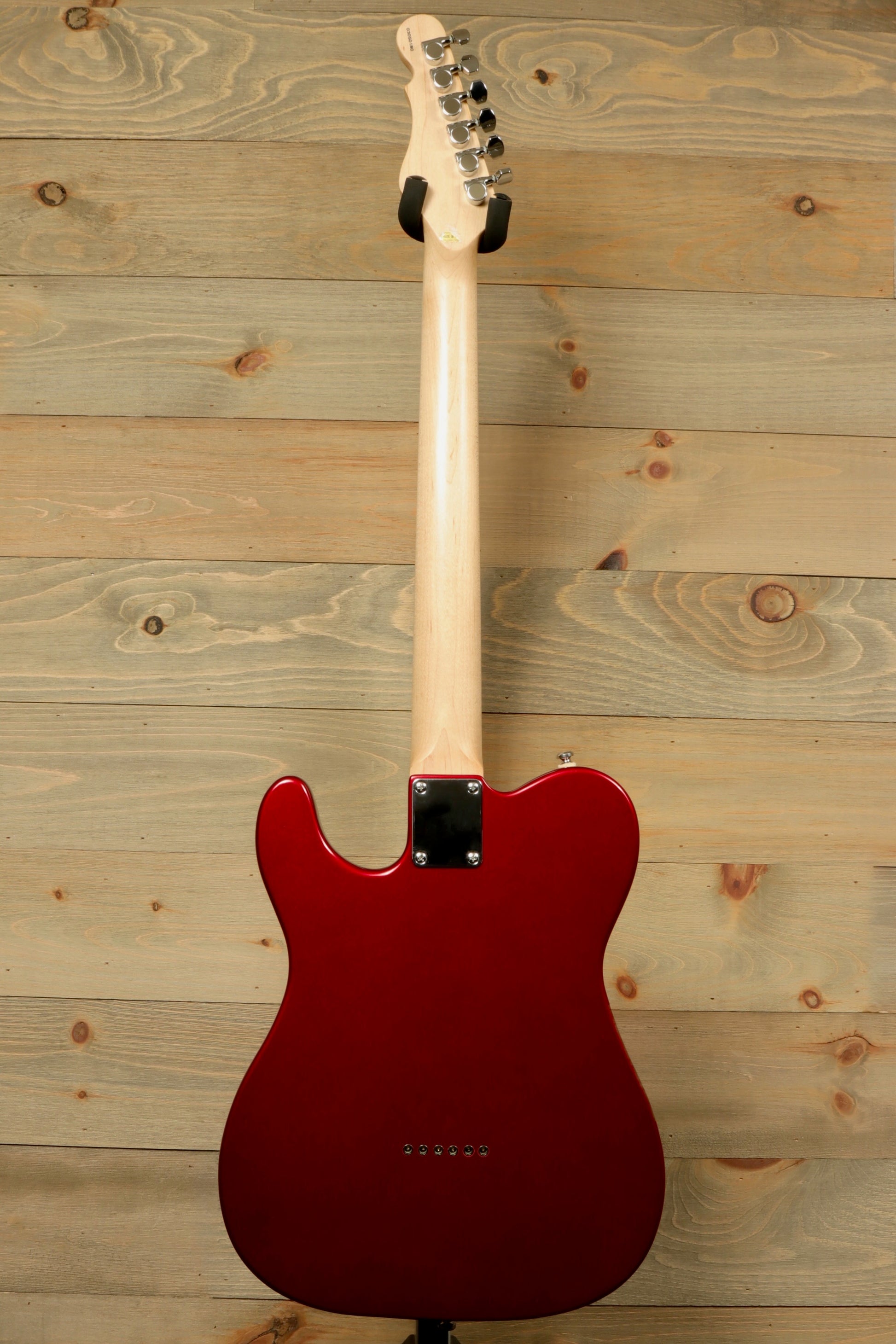 Back view of G&L Tribute ASAT Classic with G&L Gig Bag showcasing the sleek red finish and maple neck