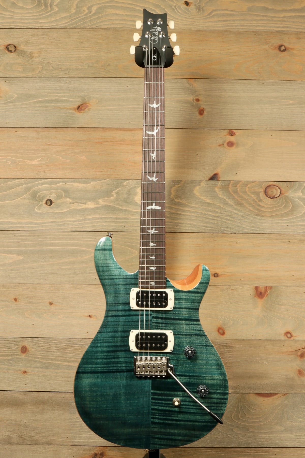 PRS Custom 24 electric guitar in whale blue, front view showcasing elegant finish and inlays