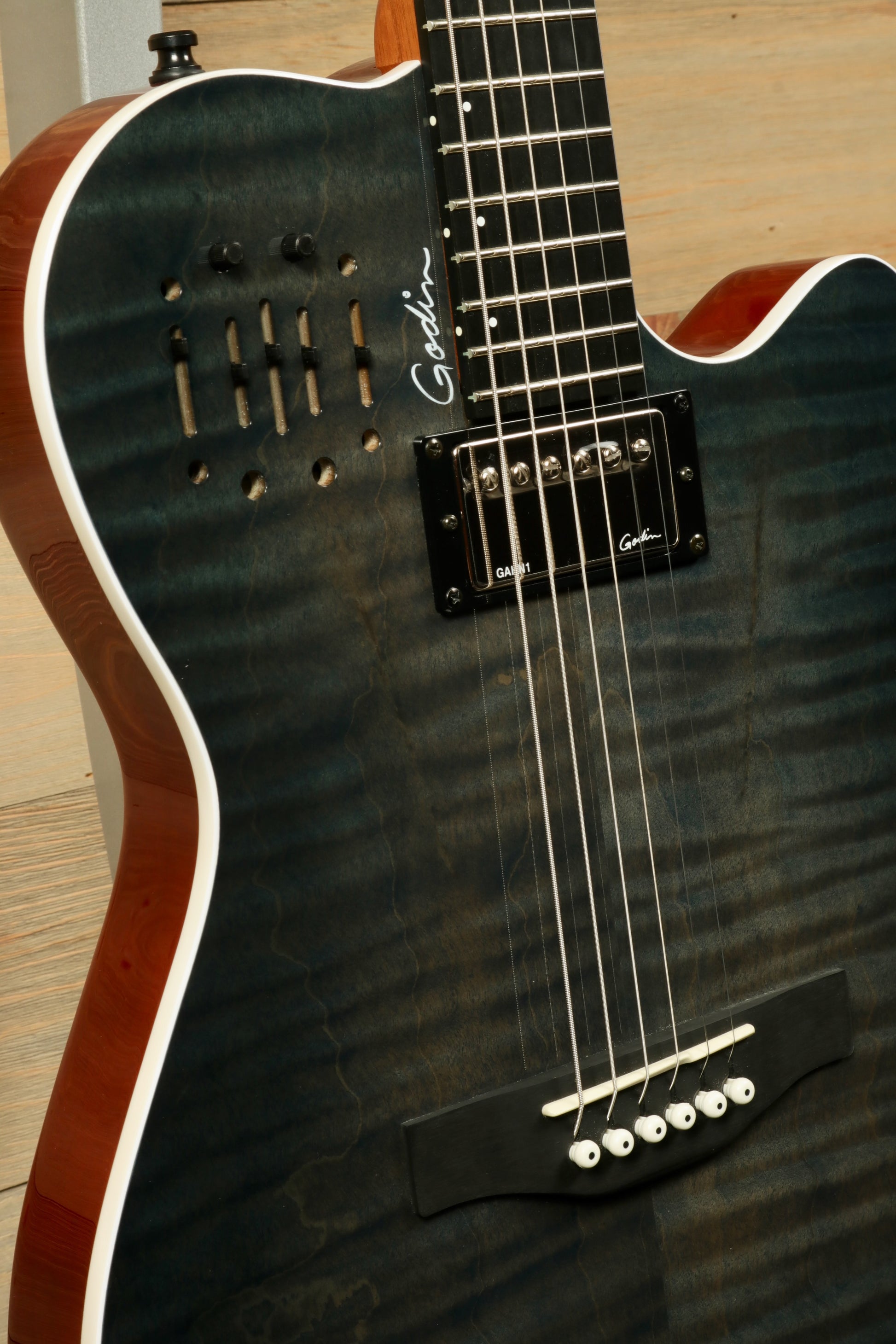 Godin A6 Ultra Denim Blue Flame Acoustic Electric Guitar with Gig Bag, showcasing beautiful grain and design.