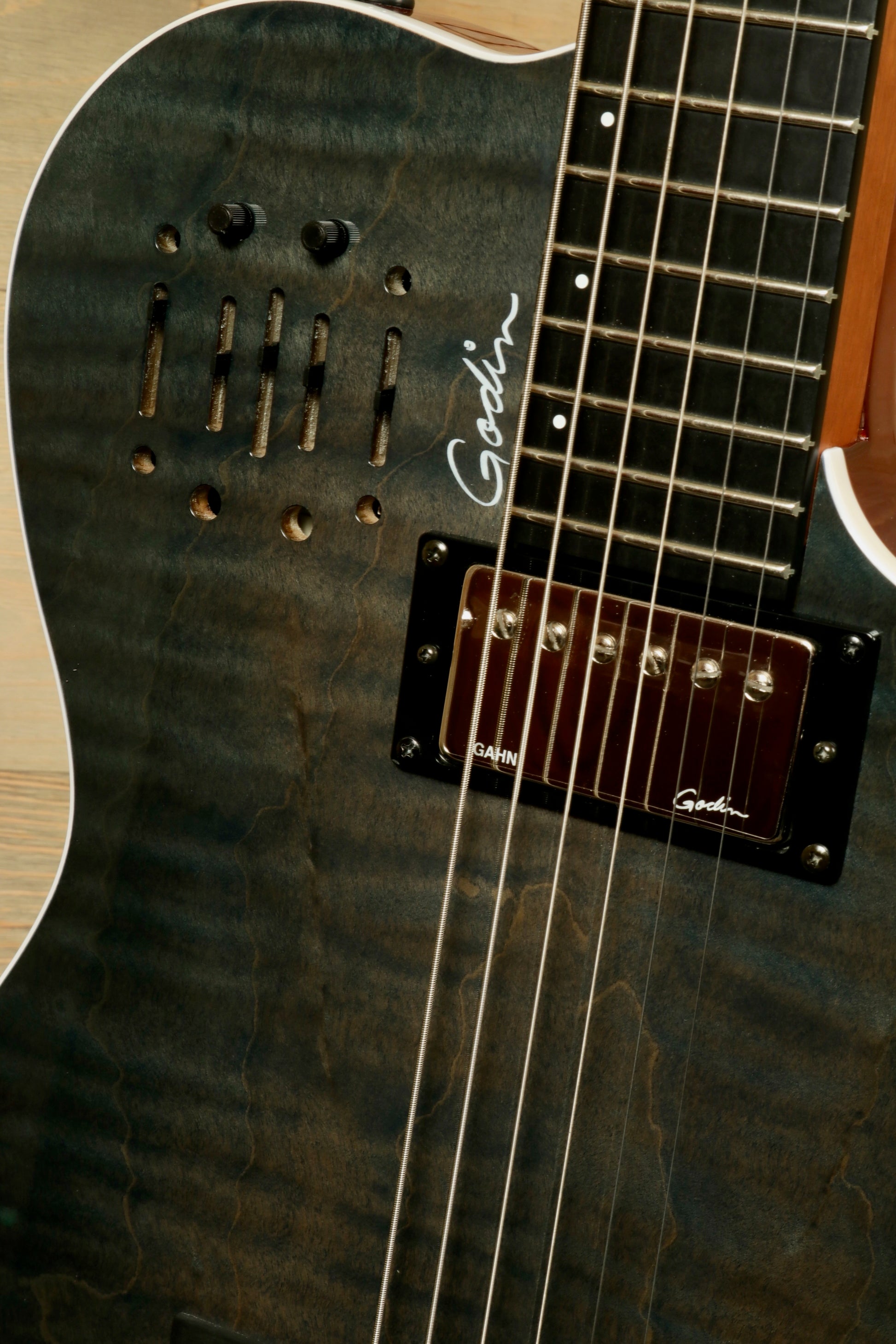 Godin A6 Ultra Denim Blue Flame Acoustic Electric Guitar with Gig Bag showcasing stunning wood grain detail