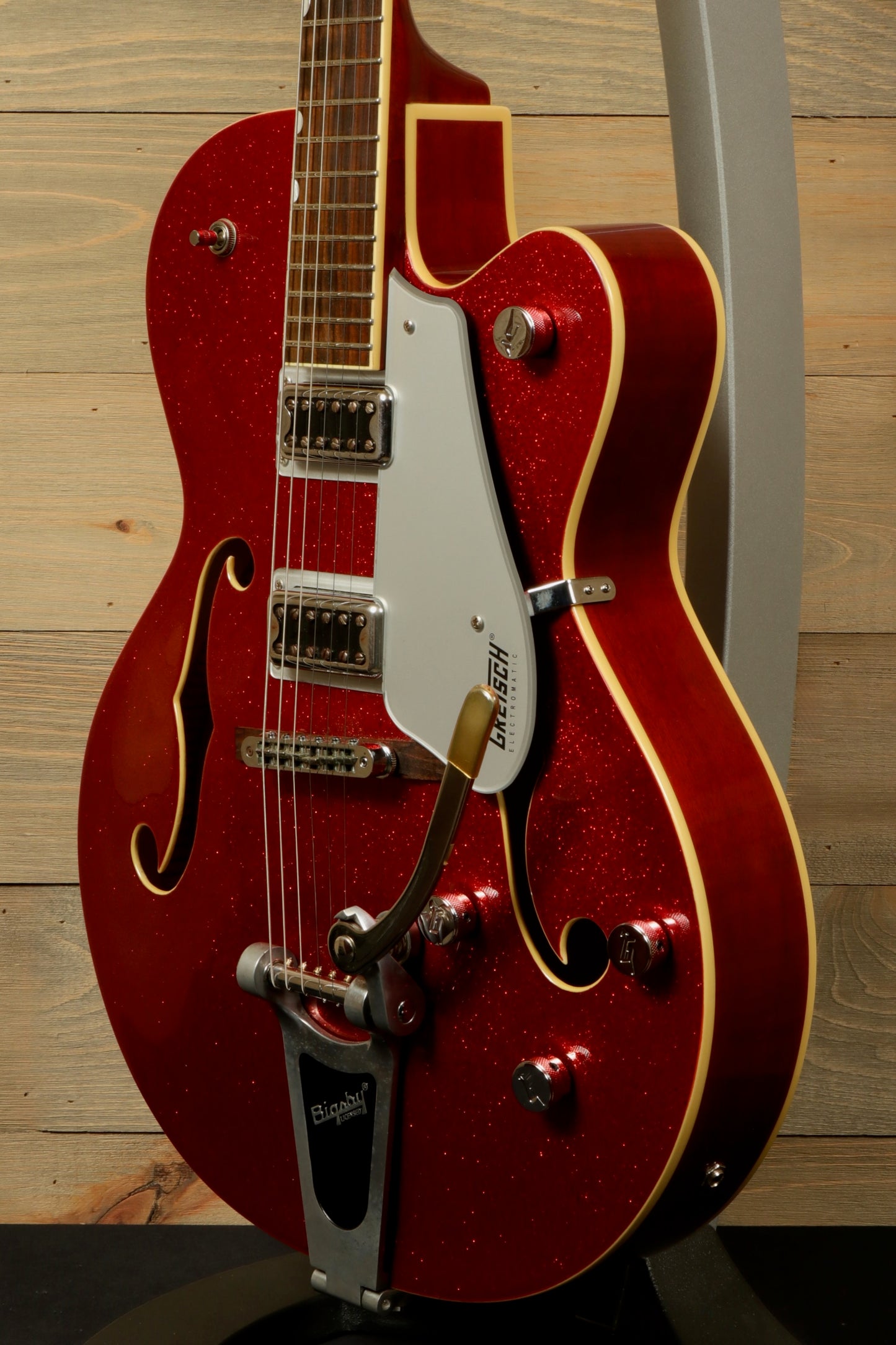 Gretsch G5420T Korea hollow body electric guitar in sparkling red, side view showcasing vintage style