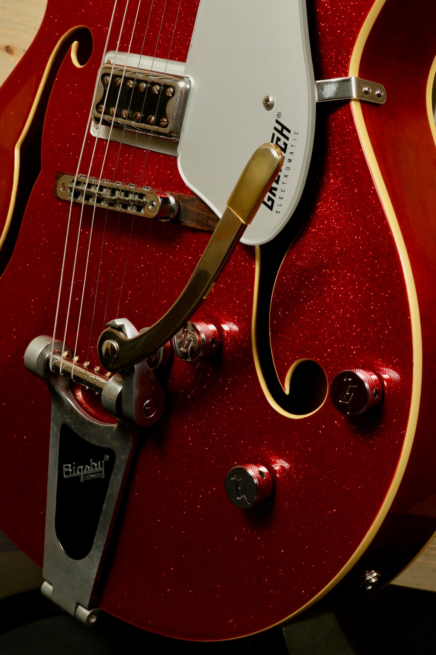 Gretsch G5420T Korea in sparkly red finish, close-up view of body and pickups