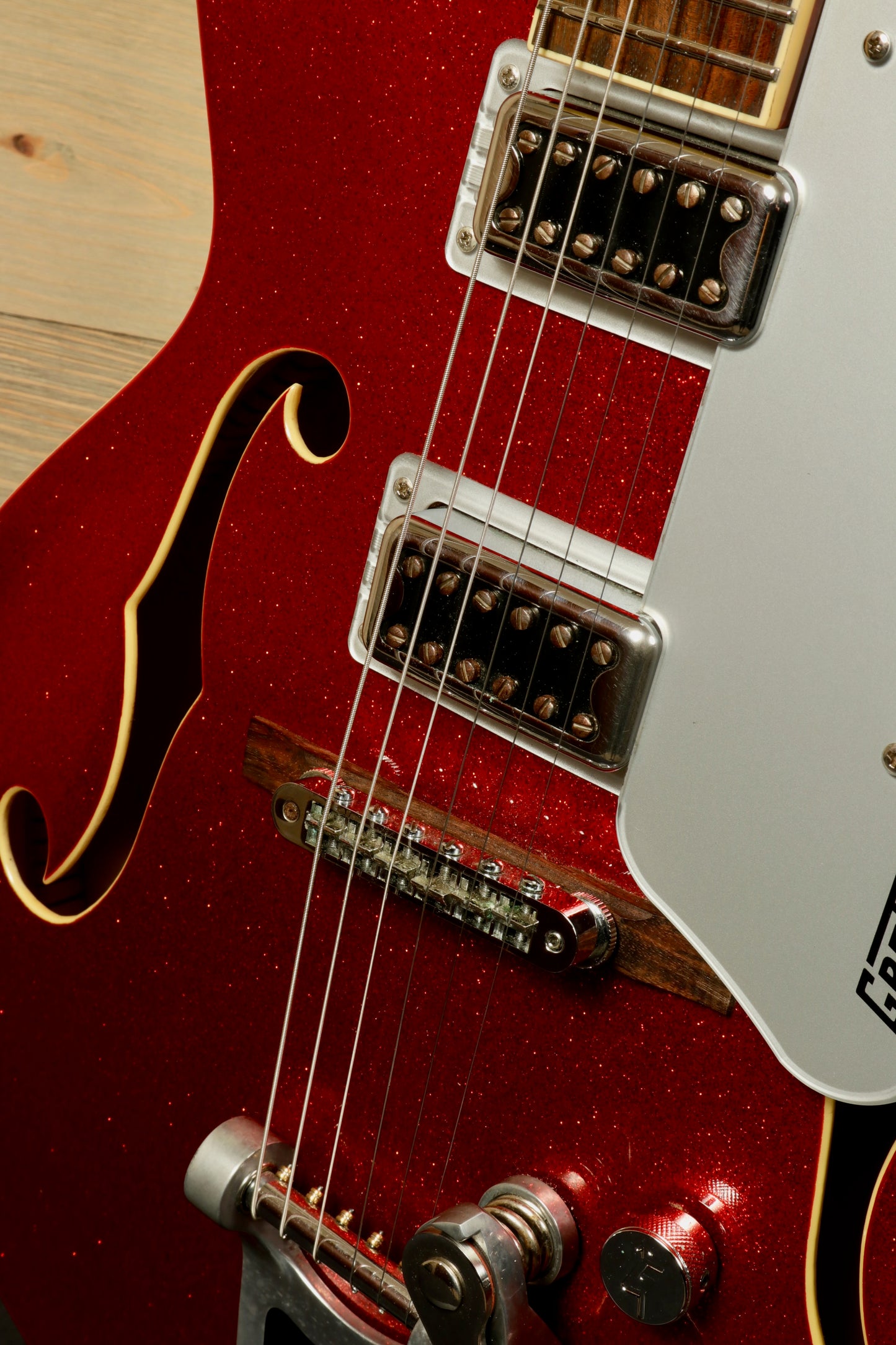 Gretsch G5420T Korea in sparkling red, close-up view showcasing pickups and strings