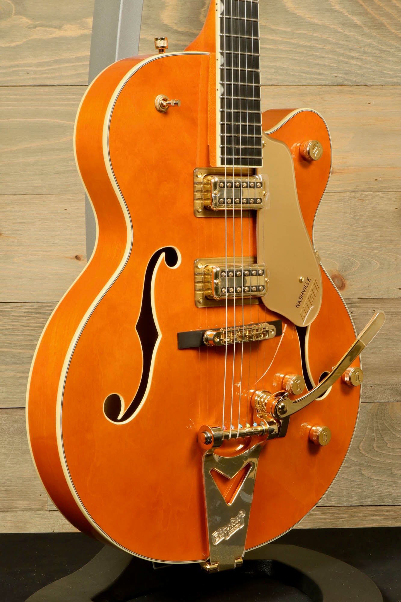 Gretsch Synchromatic Nashville hollow body guitar in orange with gold hardware and classic design 