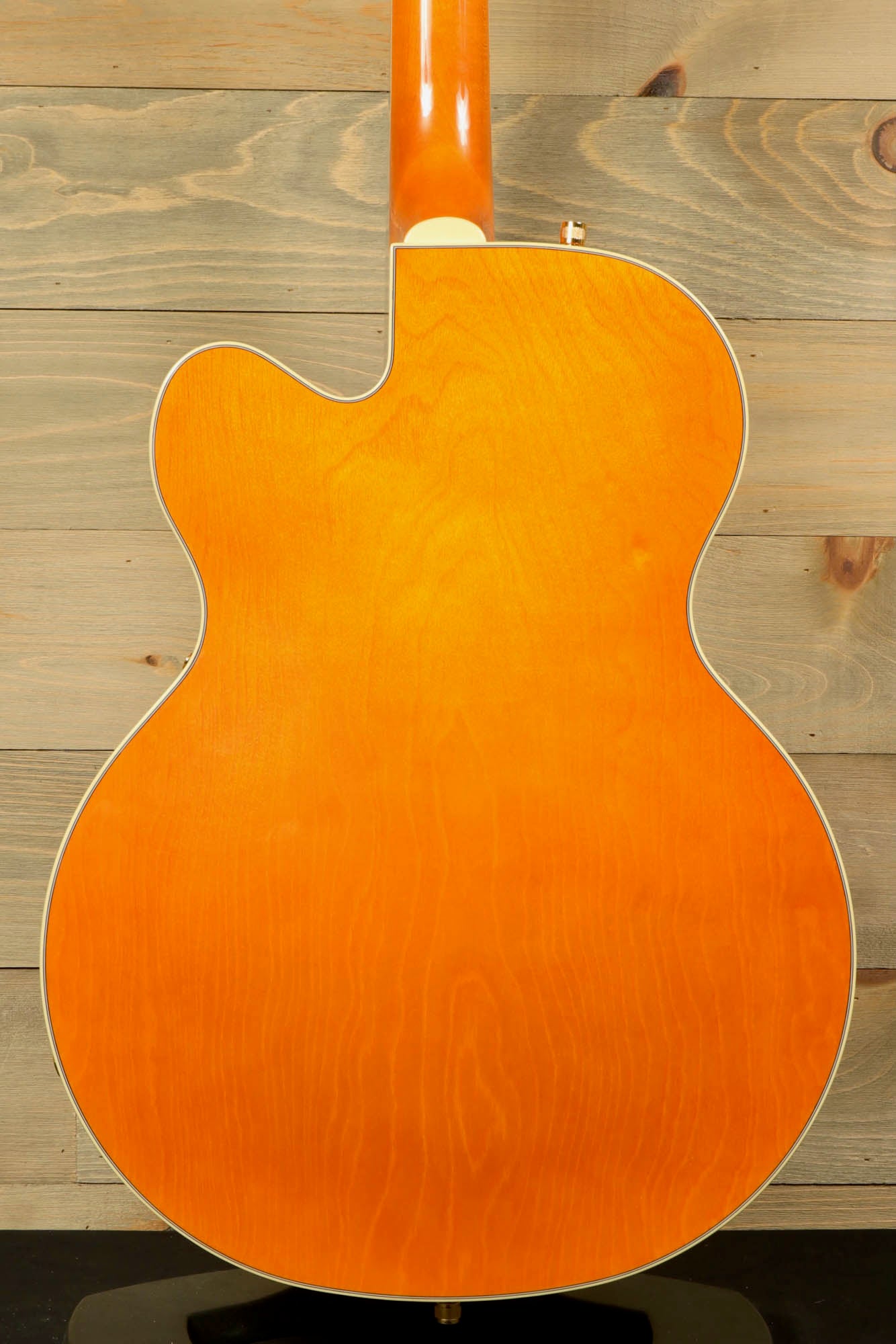 Back view of the Gretsch Synchromatic Nashville hollow body guitar showcasing its vibrant orange finish