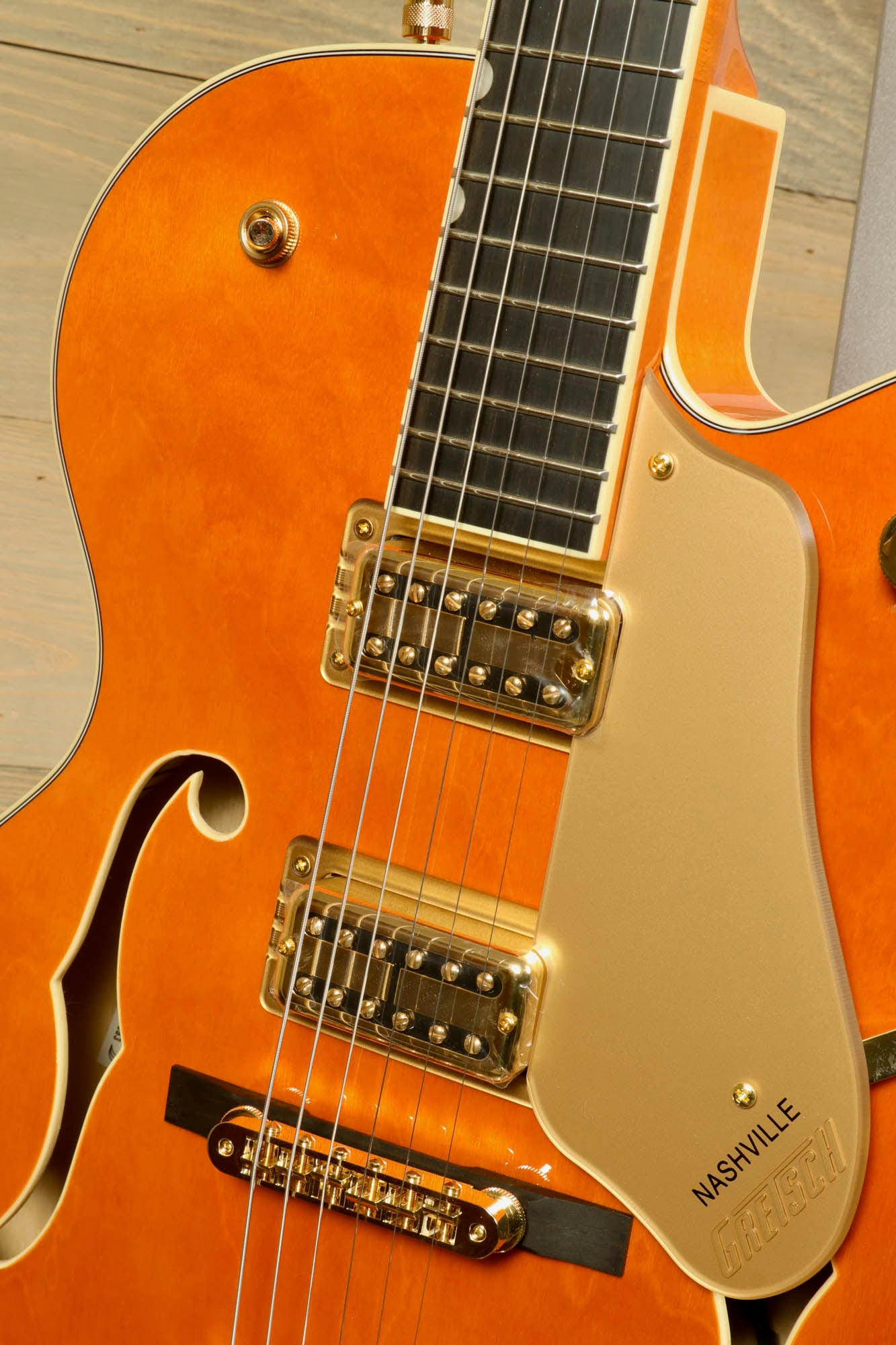 Gretsch Synchromatic Nashville hollow body guitar in orange finish with gold hardware and elegant design