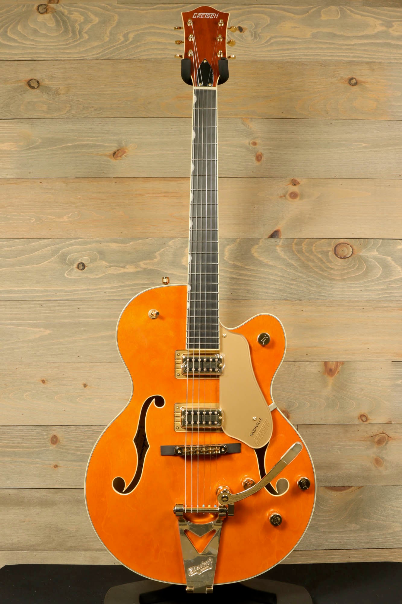 Gretsch Synchromatic Nashville hollow body guitar in orange with gold accents and double cutaway design