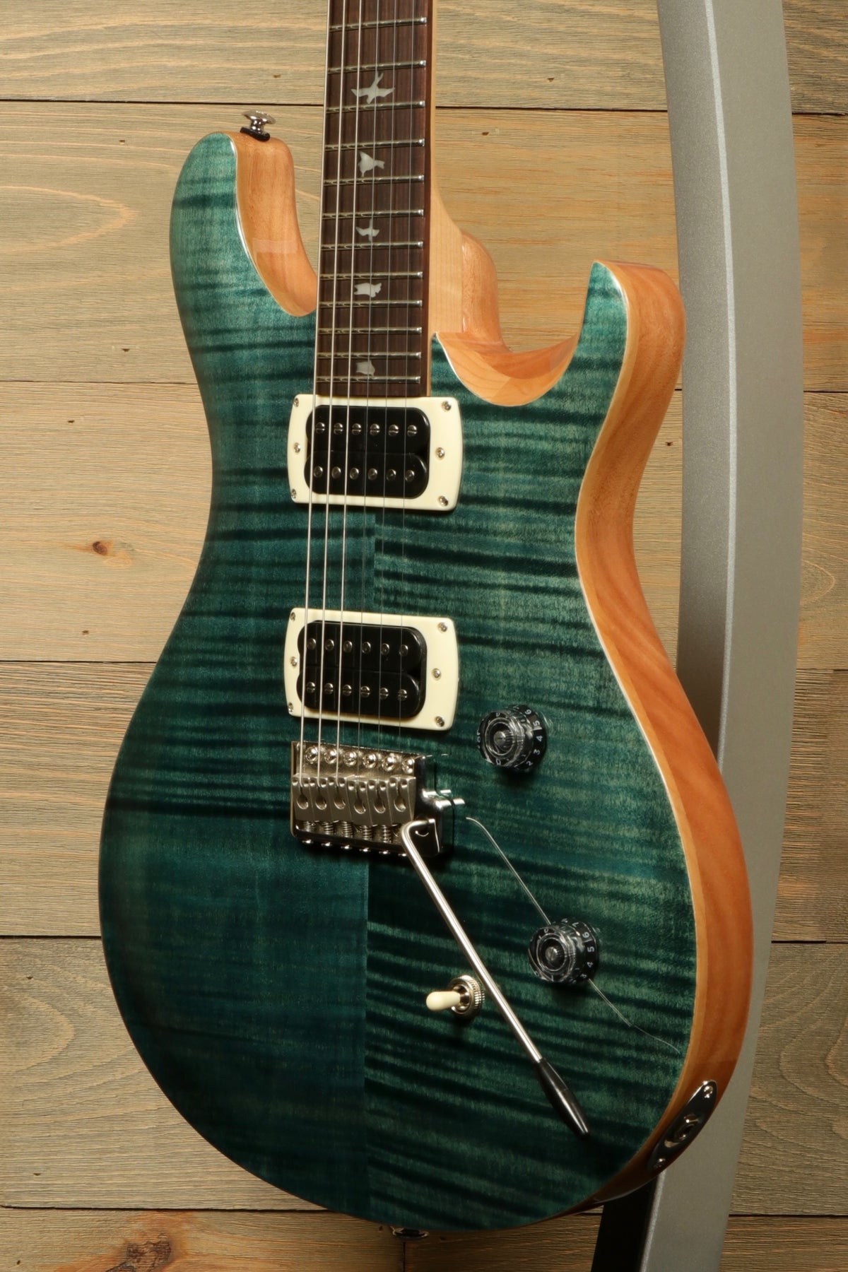 PRS electric guitar custom model in teal burst, front view highlighting the stunning finish