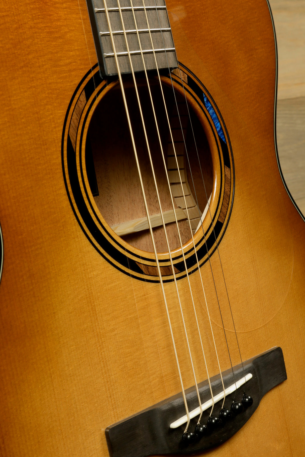 Yamaha acoustic electric guitar in sunburst finish, close-up view of strings and soundhole