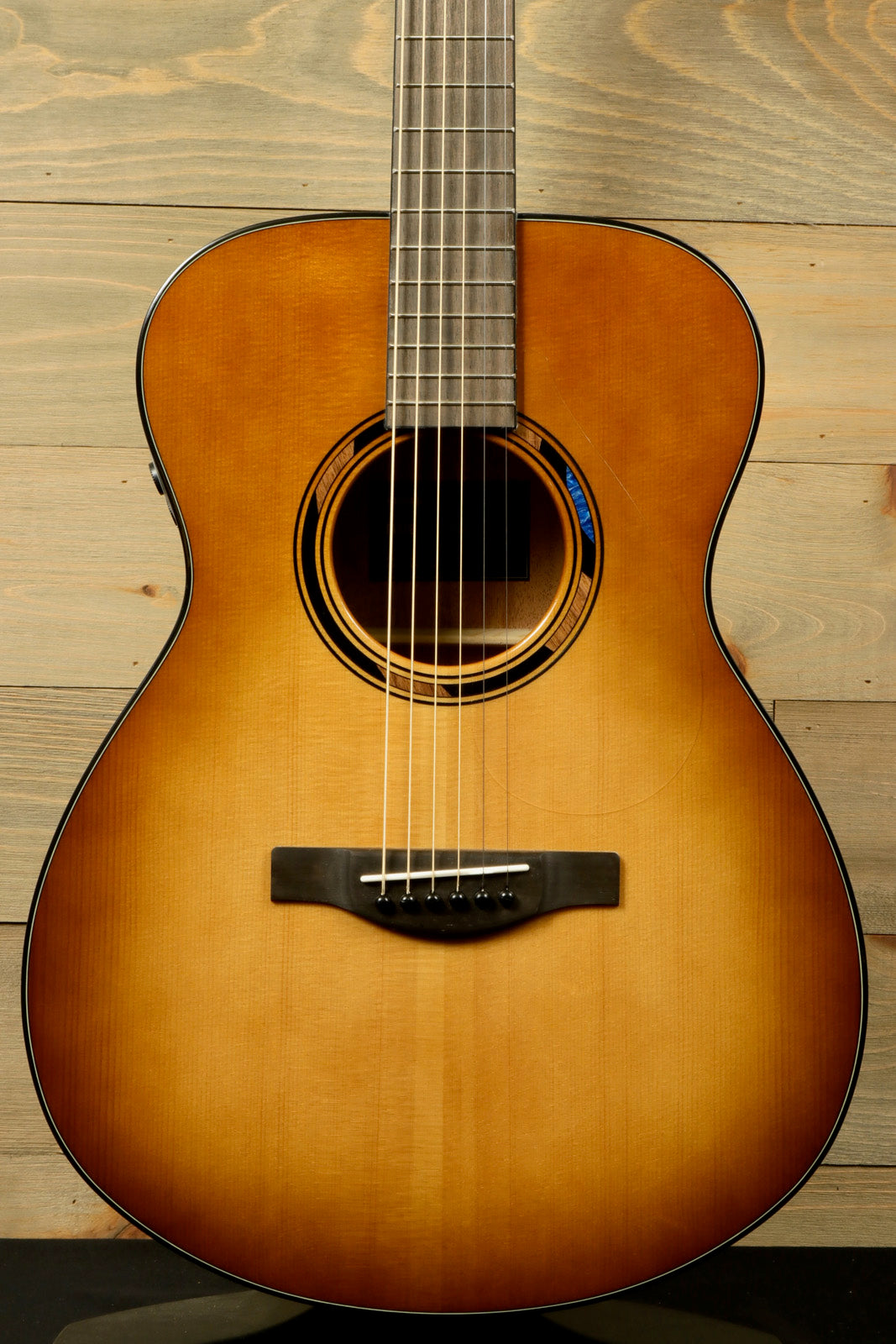 Yamaha acoustic electric guitar with sunburst finish, front view