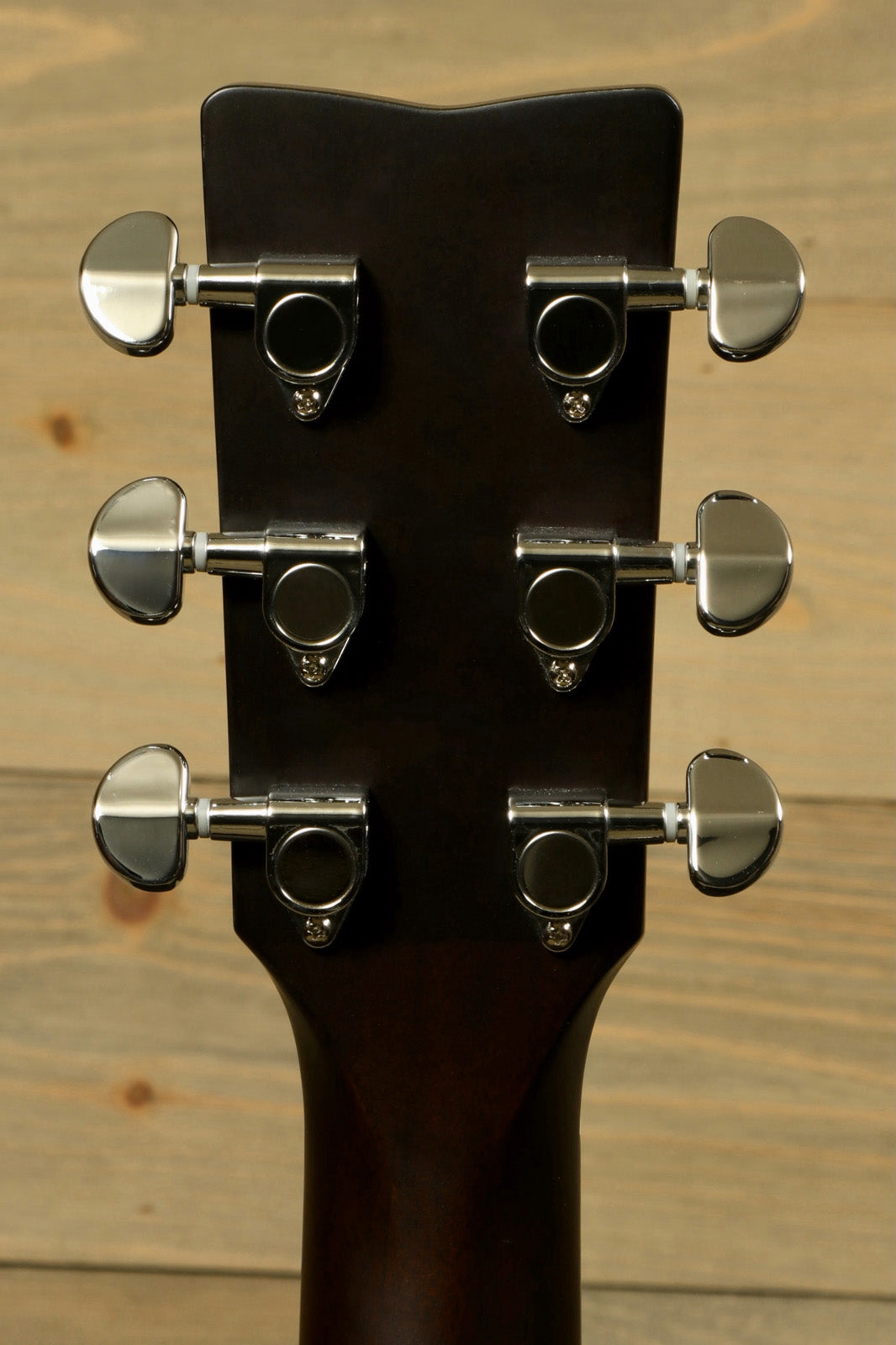 Yamaha electric and acoustic guitar headstock with six chrome tuning pegs, rear view