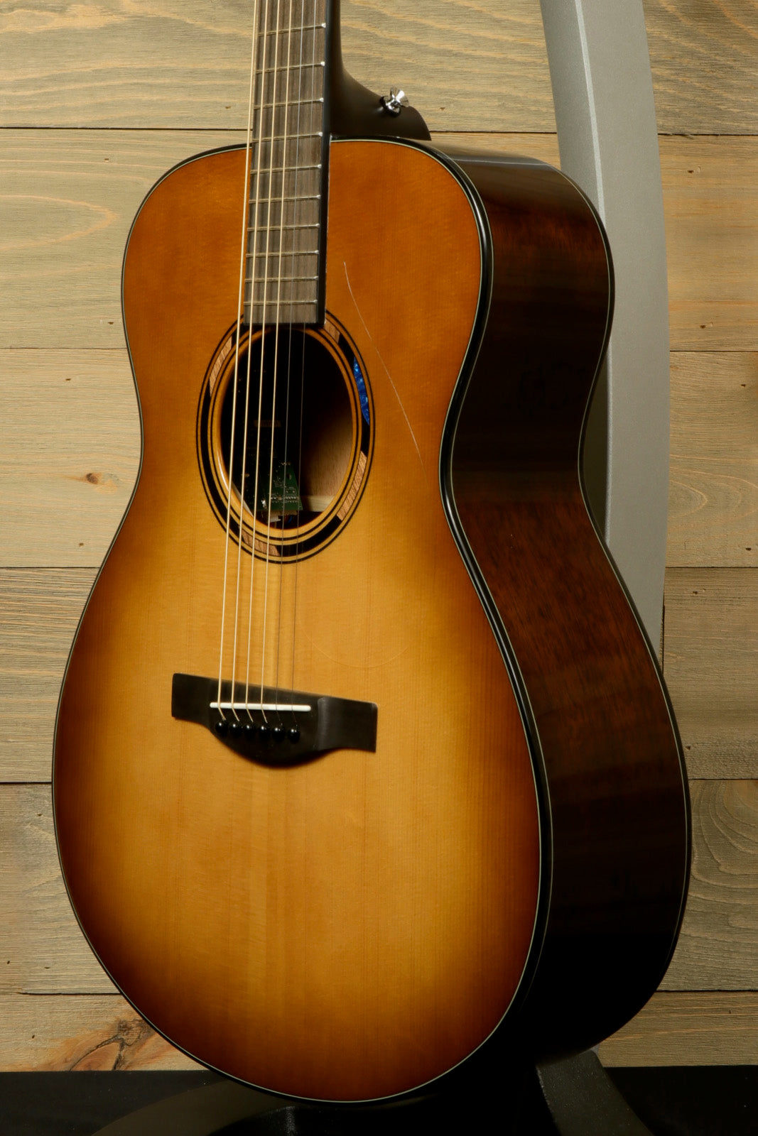 Yamaha acoustic electric guitar in sunburst finish, front view showcasing the body and neck