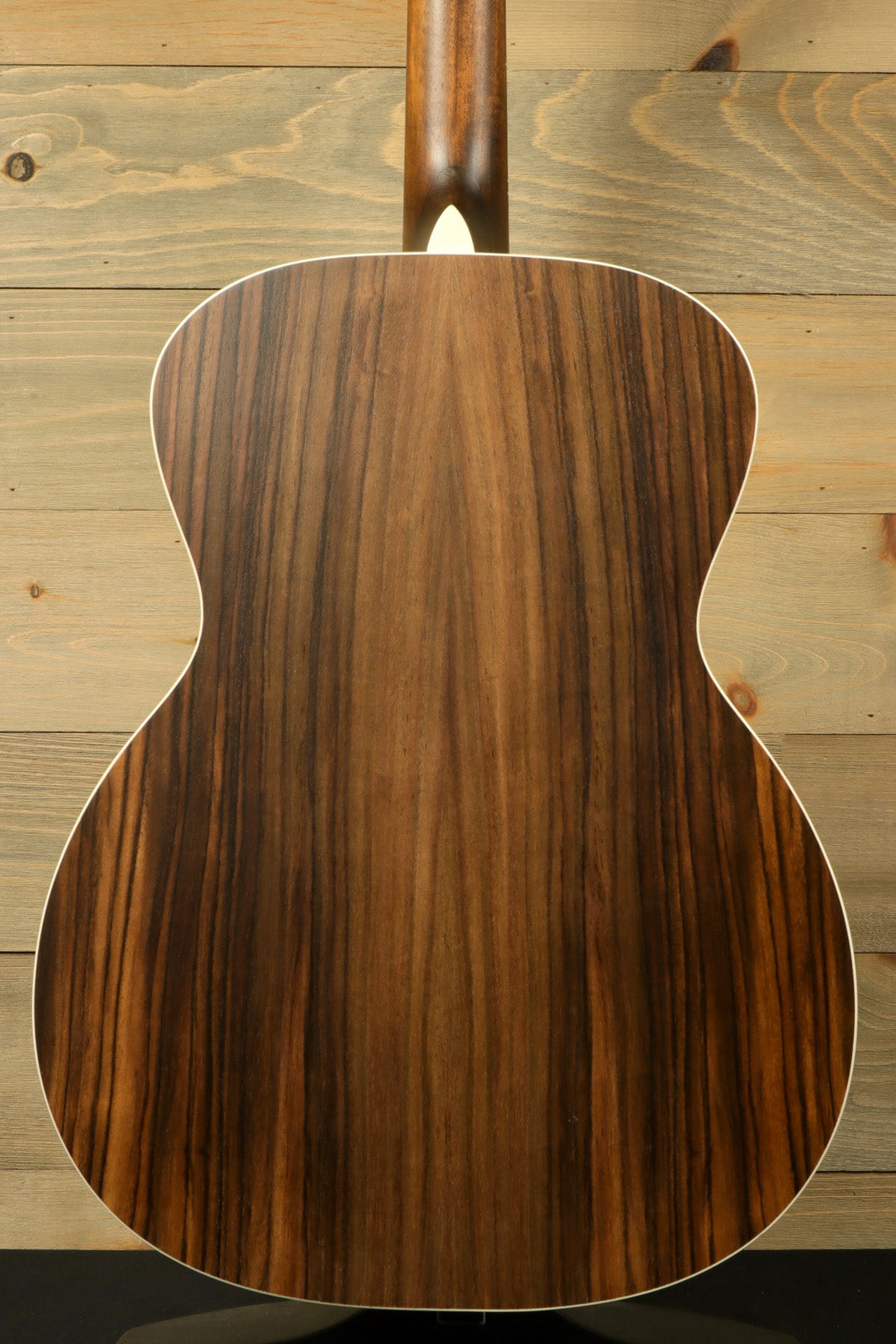Eastman PCH2-OM-CLA acoustic guitar back view showcasing rich wood grain finish