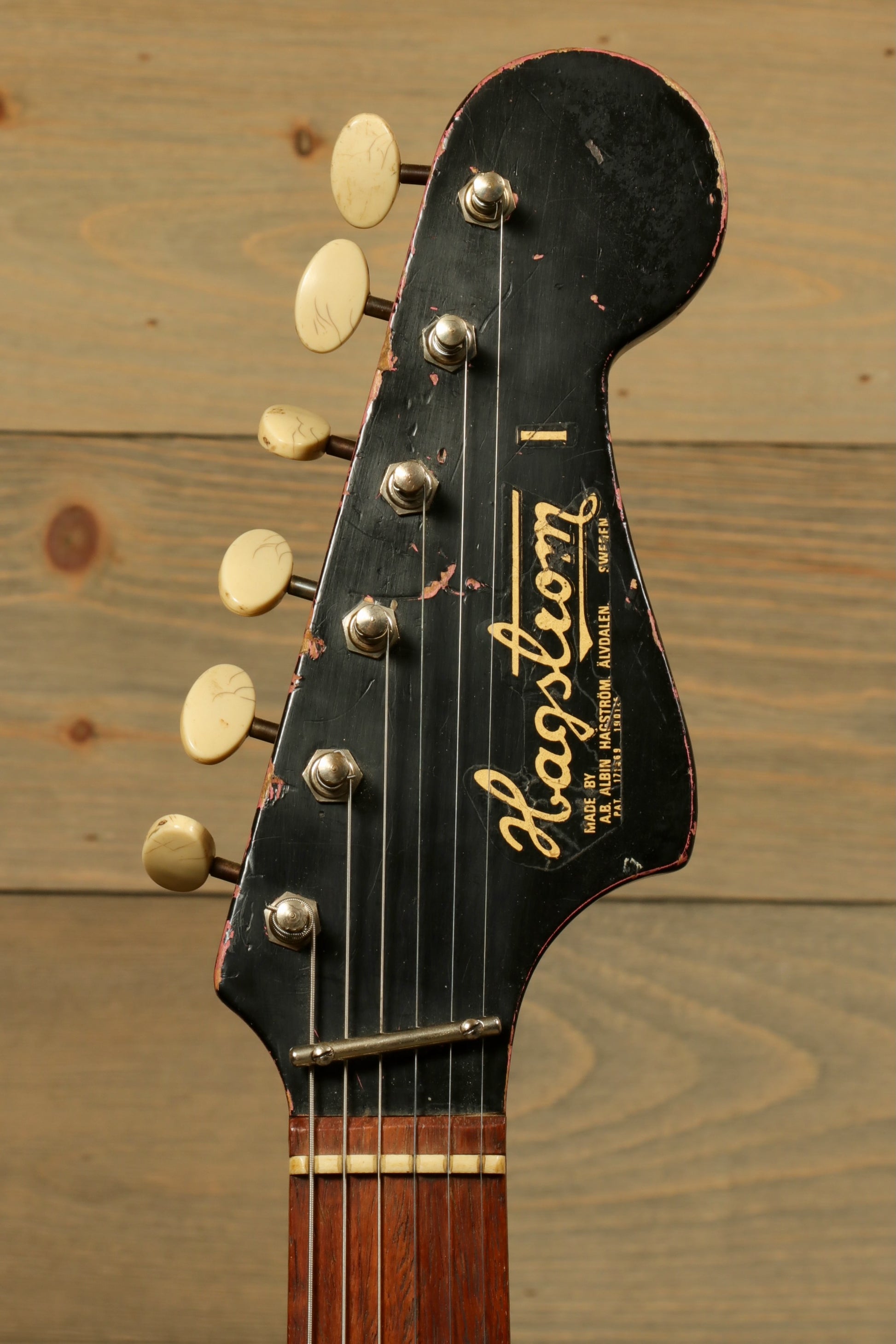Vintage Hagstrom I electric guitar headstock with gold hardware, front view