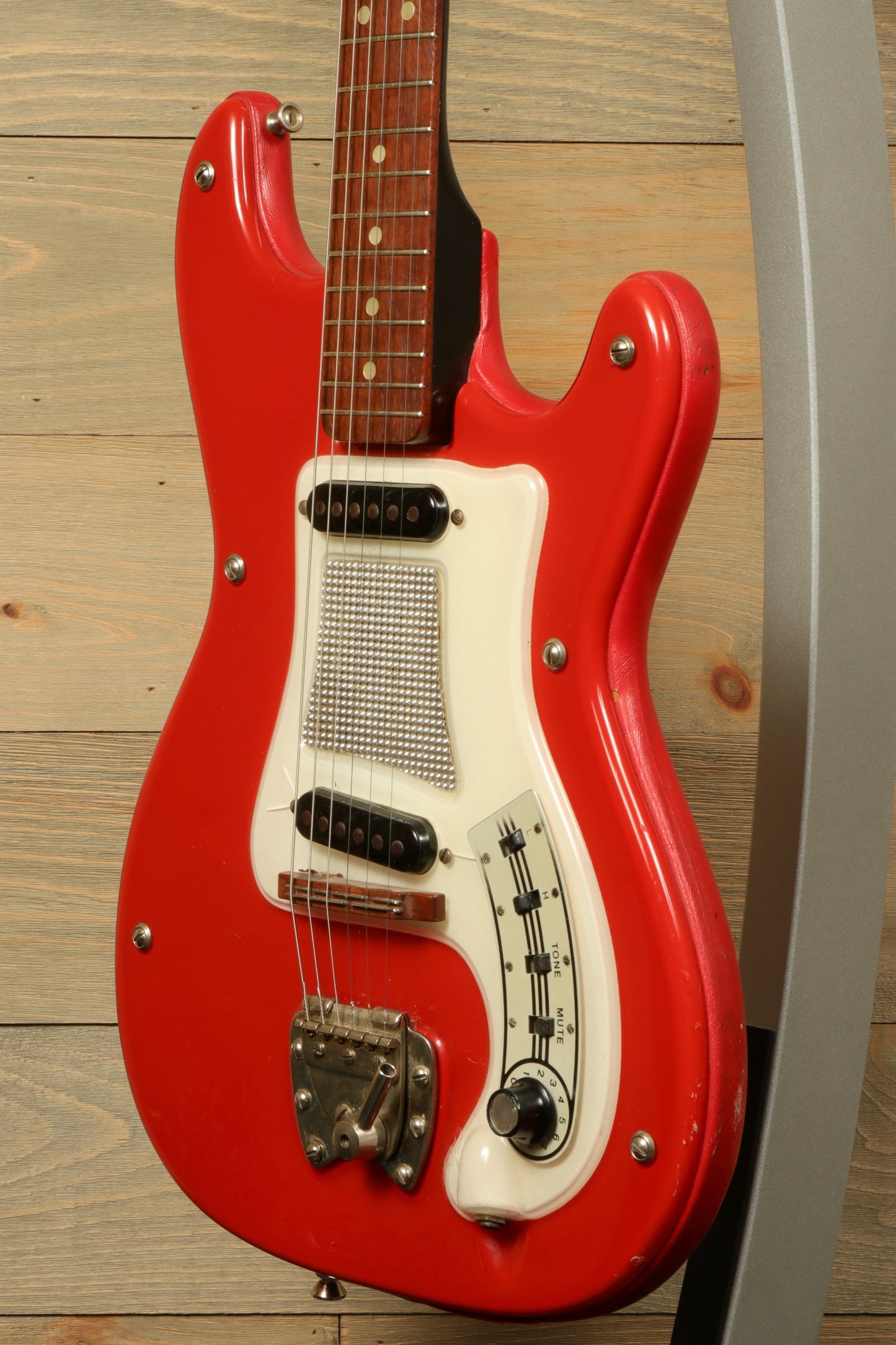 Hagstrom Vintage I electric guitar in red with gig bag, side view showing unique design