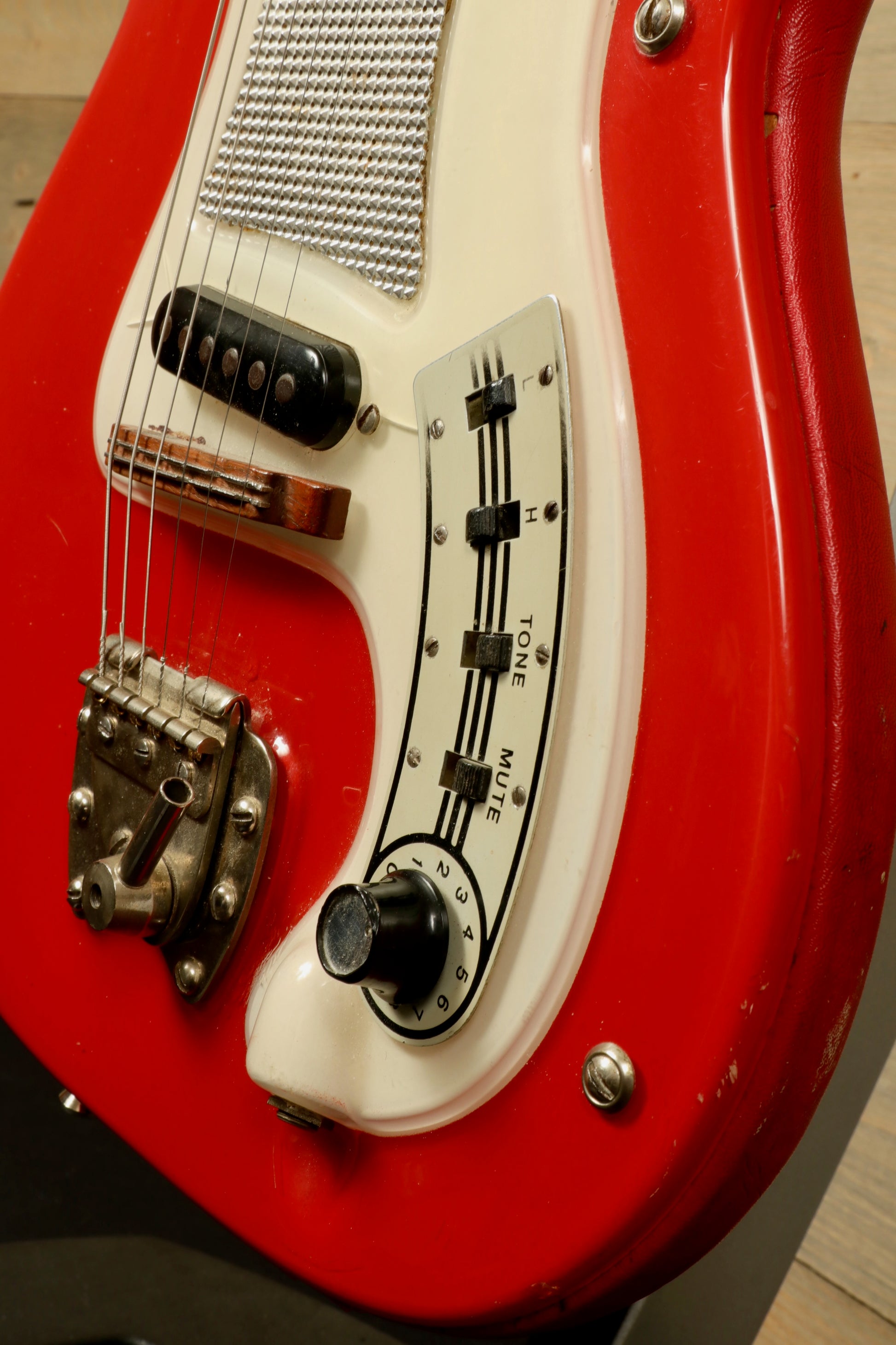 Hagstrom Vintage I electric guitar in red with controls and gig bag, side view