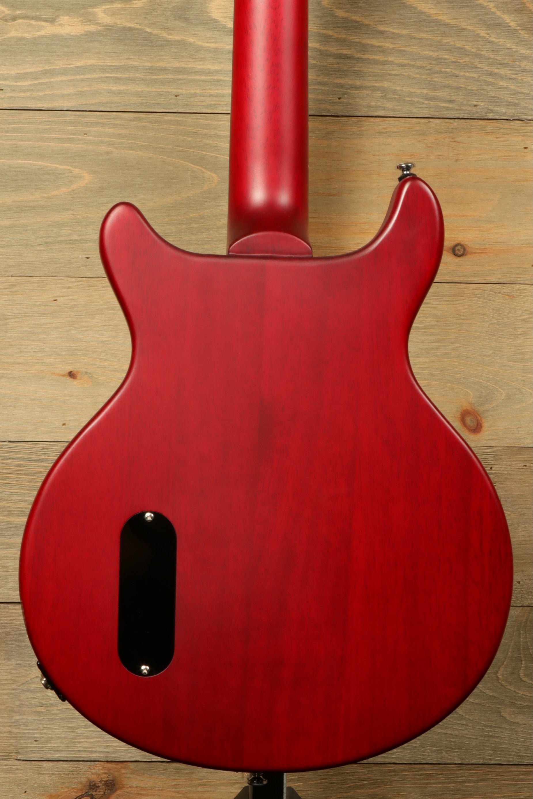 Harley Benton DC-Jr Faded Cherry, back view showcasing smooth red finish.