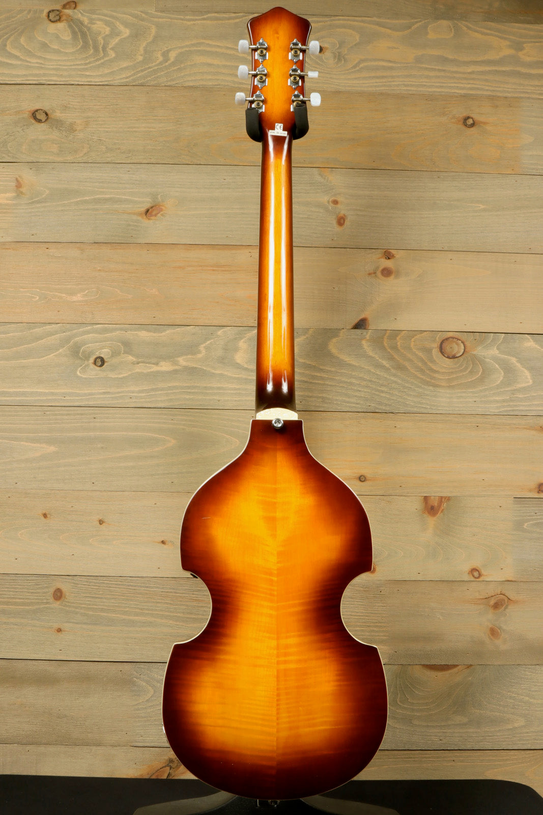 Hofner Guitar hollow body, sunburst finish, back view showcasing elegant curves