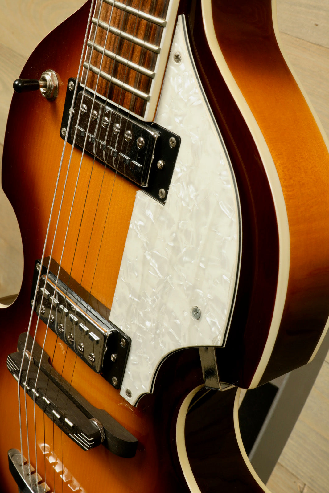 Hofner Guitar hollow body electric guitar, sunburst finish, close-up view of body and pickguard
