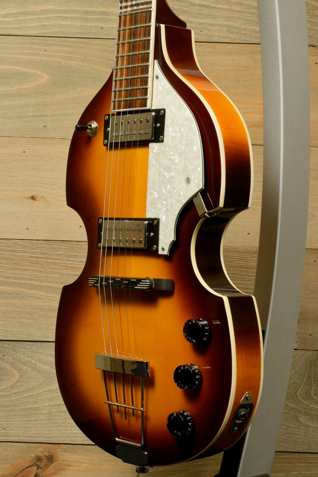 Hofner Guitar hollow body electric guitar in sunburst finish, side view with controls and pickguard