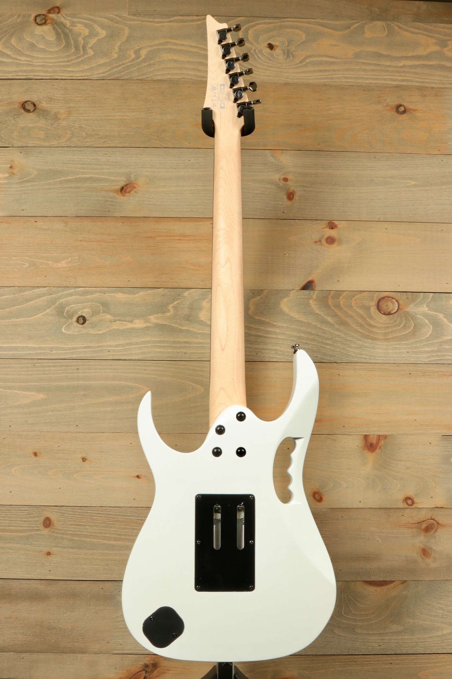 Ibanez JEMJR Steve Vai white guitar, back view showcasing the sleek design and neck