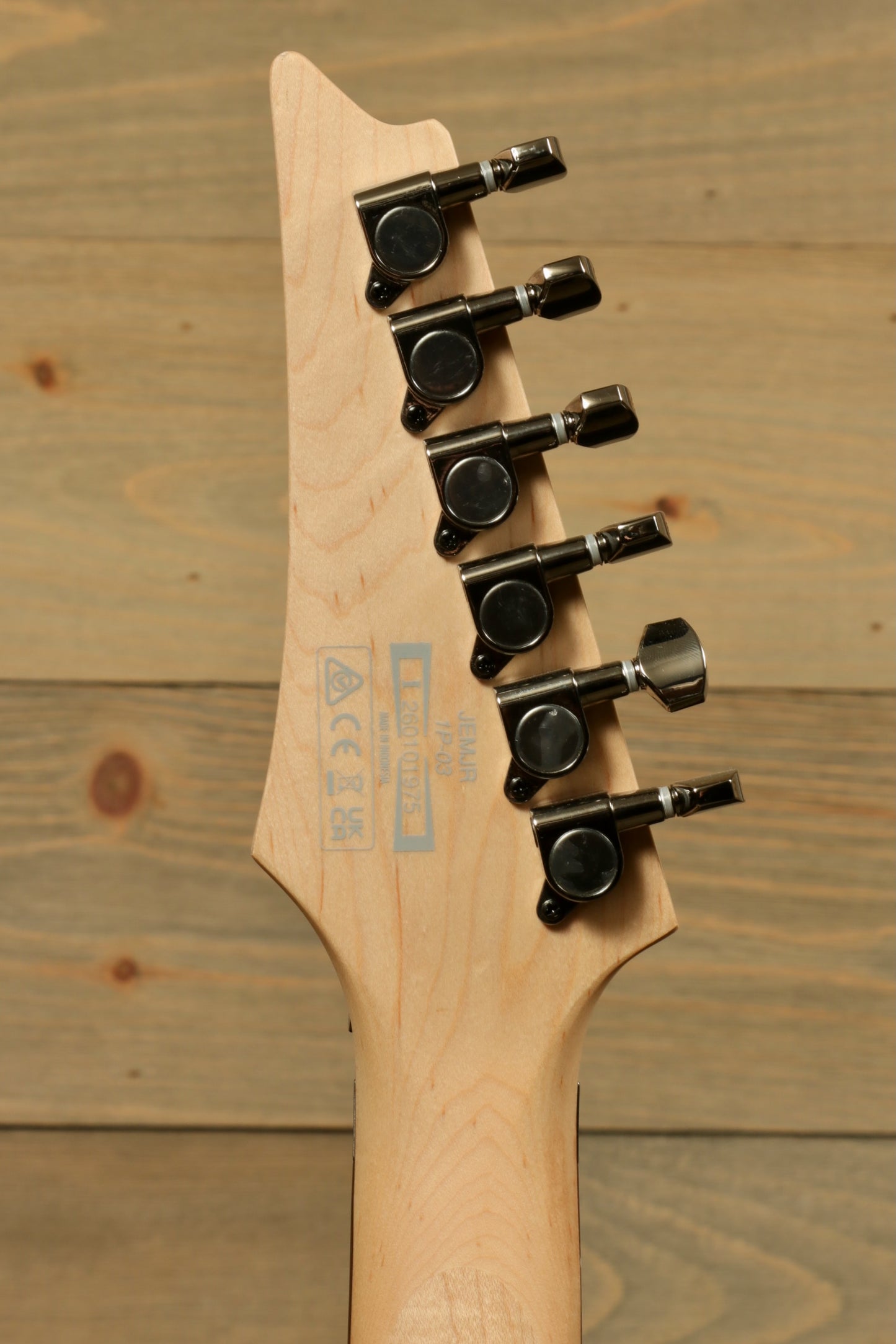 Ibanez JEMJR Steve Vai guitar headstock in natural finish, rear view showcasing tuning pegs
