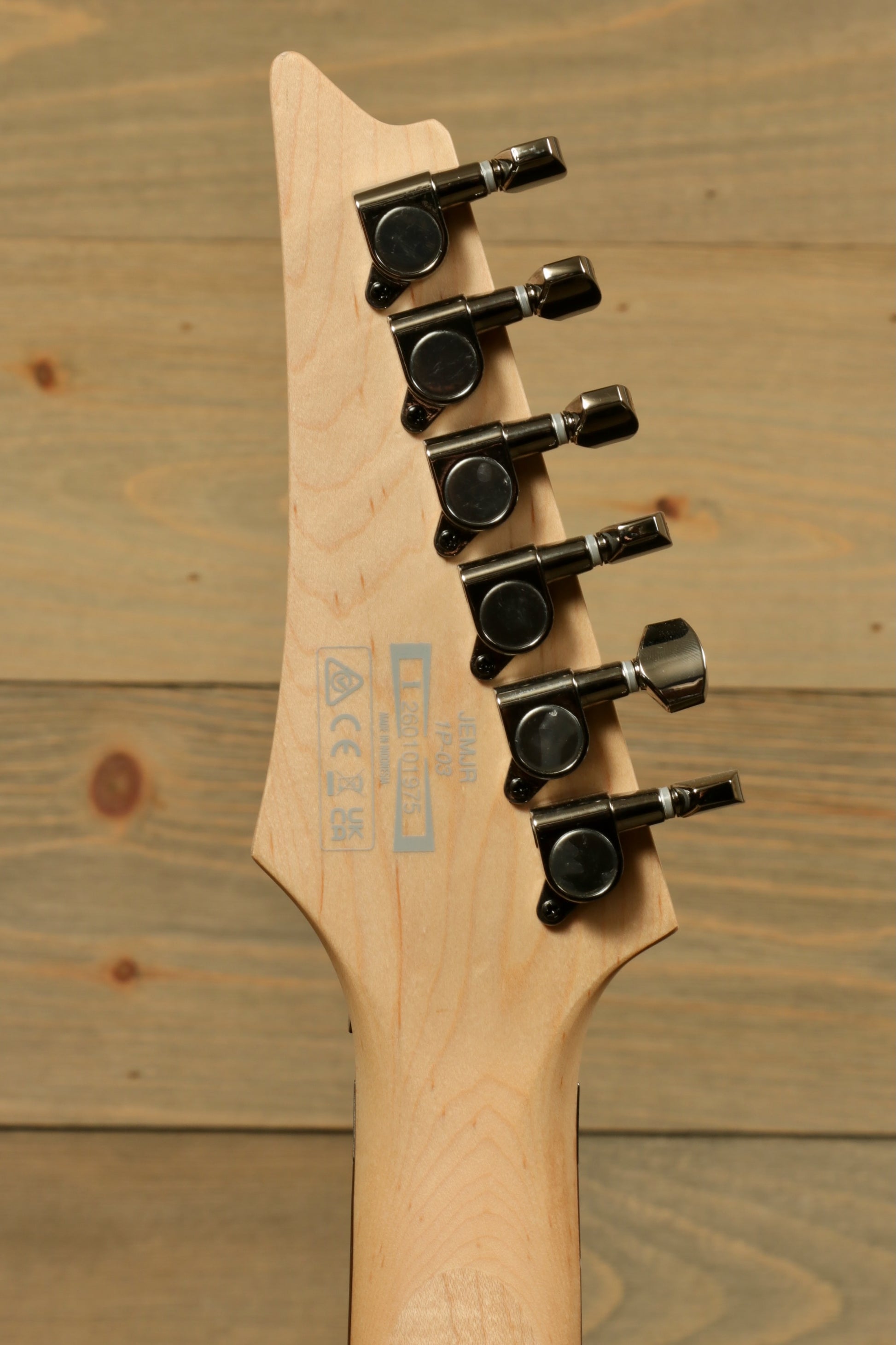 Ibanez JEMJR Steve Vai guitar headstock in natural finish, rear view showcasing tuning pegs