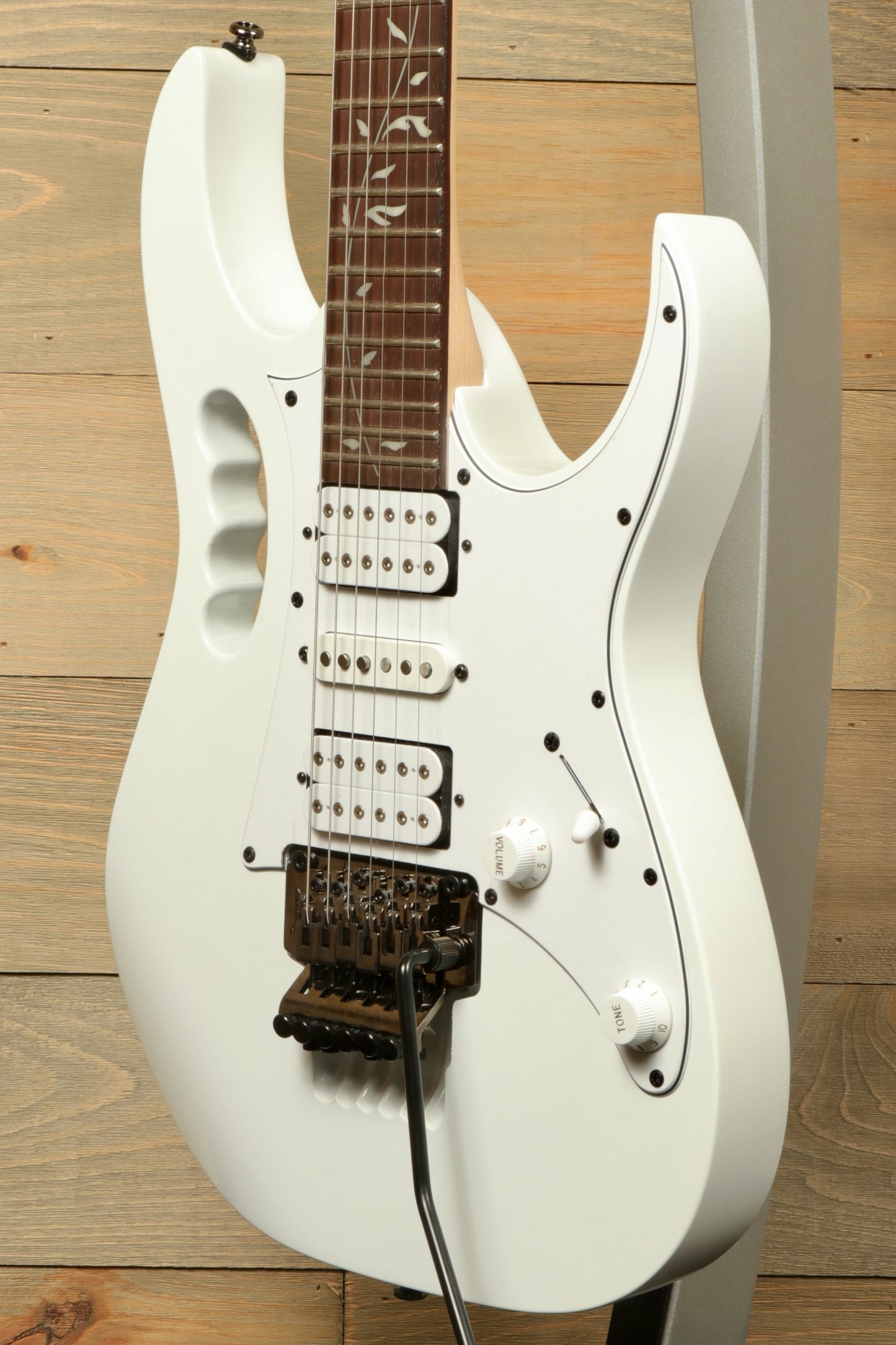 Ibanez JEMJR Steve Vai white guitar, front view with distinctive design features