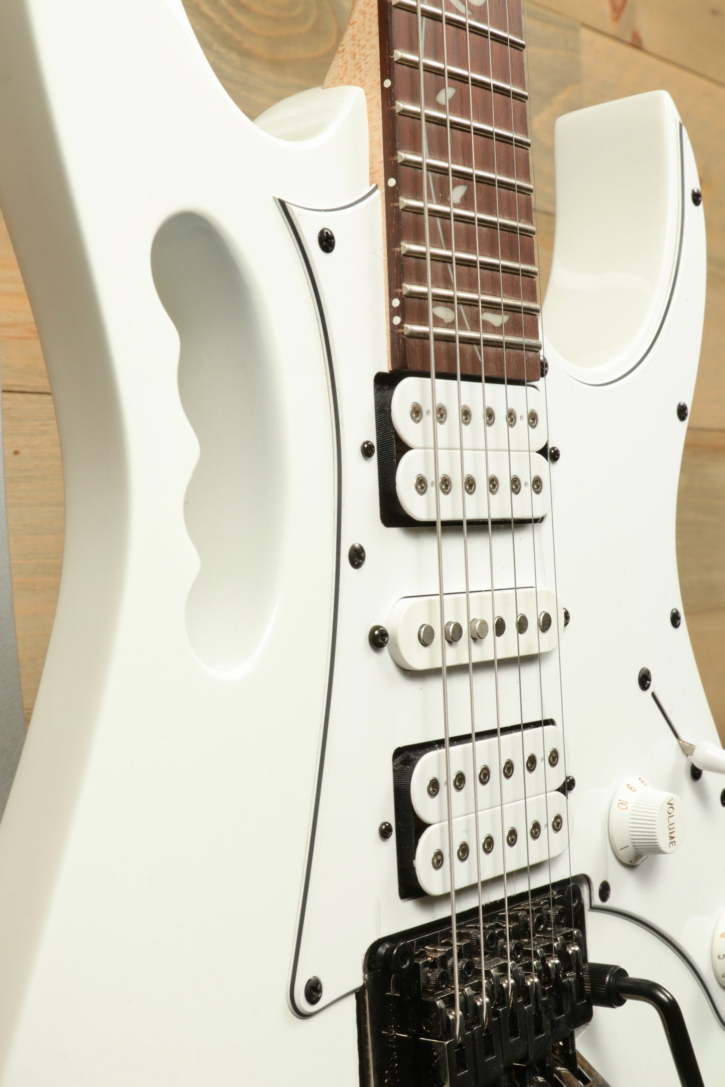 Ibanez JEMJR Steve Vai electric guitar in white, close-up view of body and neck