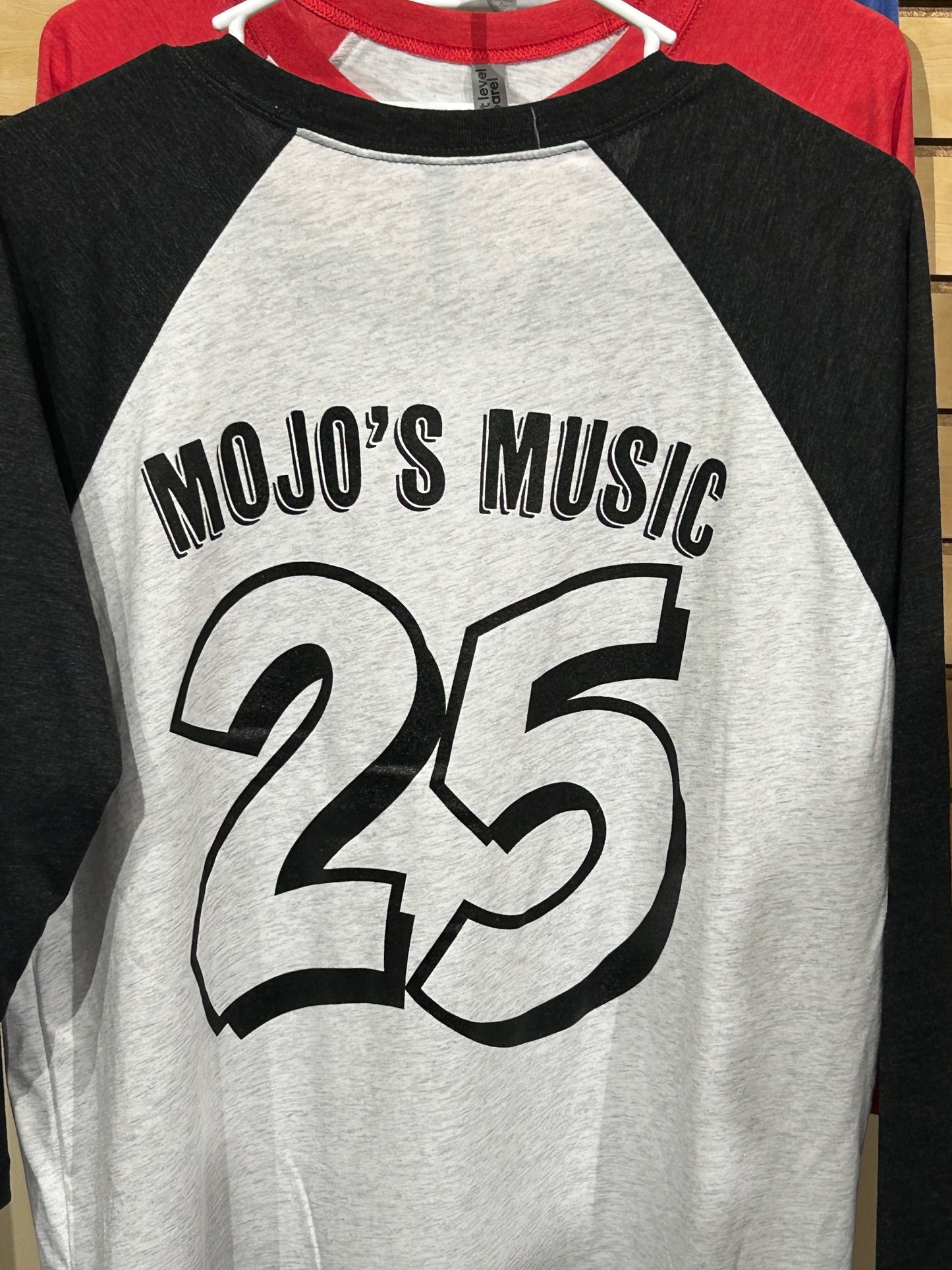 Mojo's 25th anniversary baseball tee in gray and black with bold lettering on the back