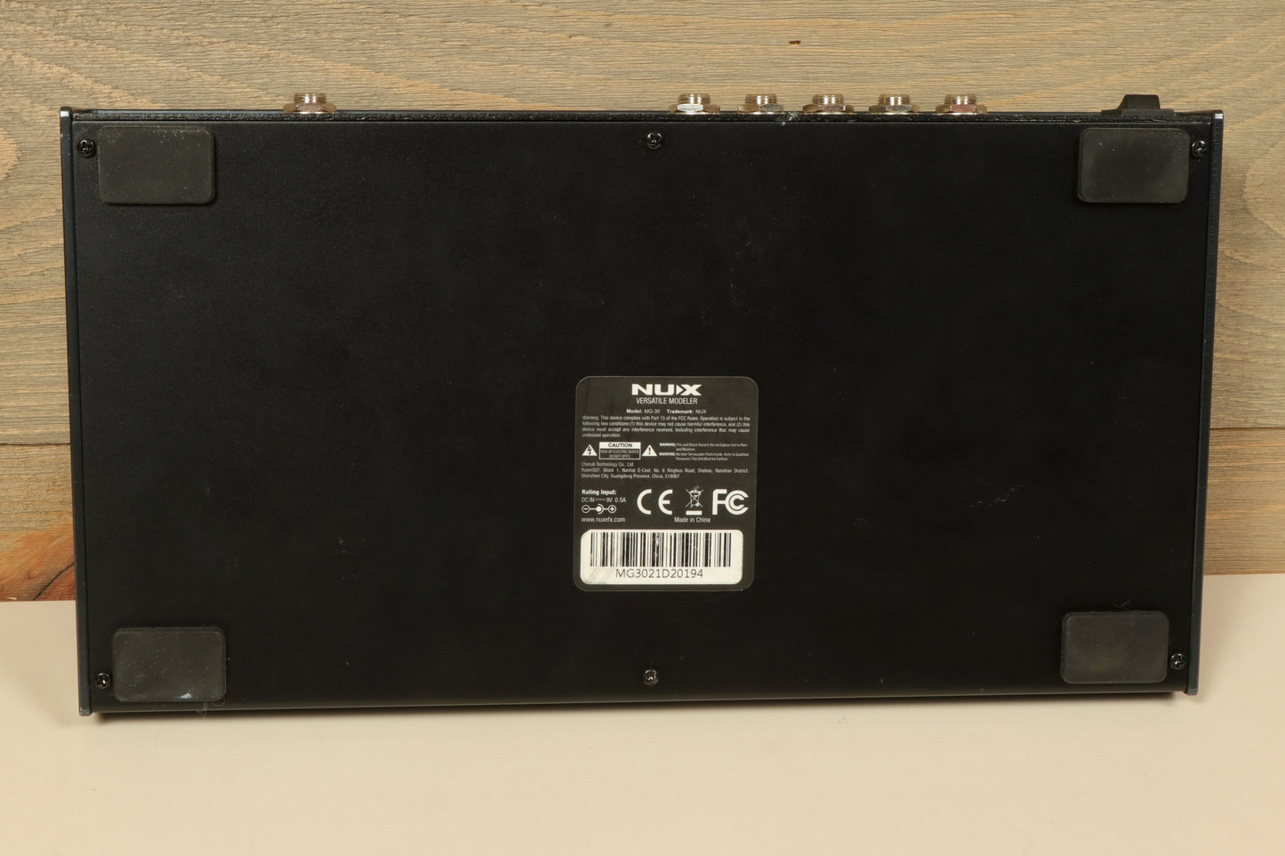 NU-X MG-30 Versatile Modeling Guitar Processor, black, rear view showcasing input and output connections