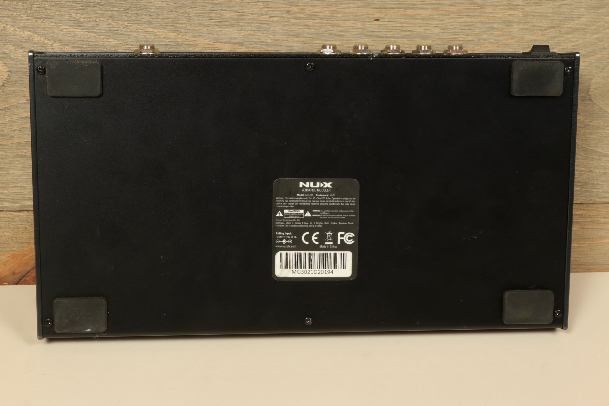 NU-X MG-30 Versatile Modeling Guitar Processor, black, rear view showcasing input and output connections