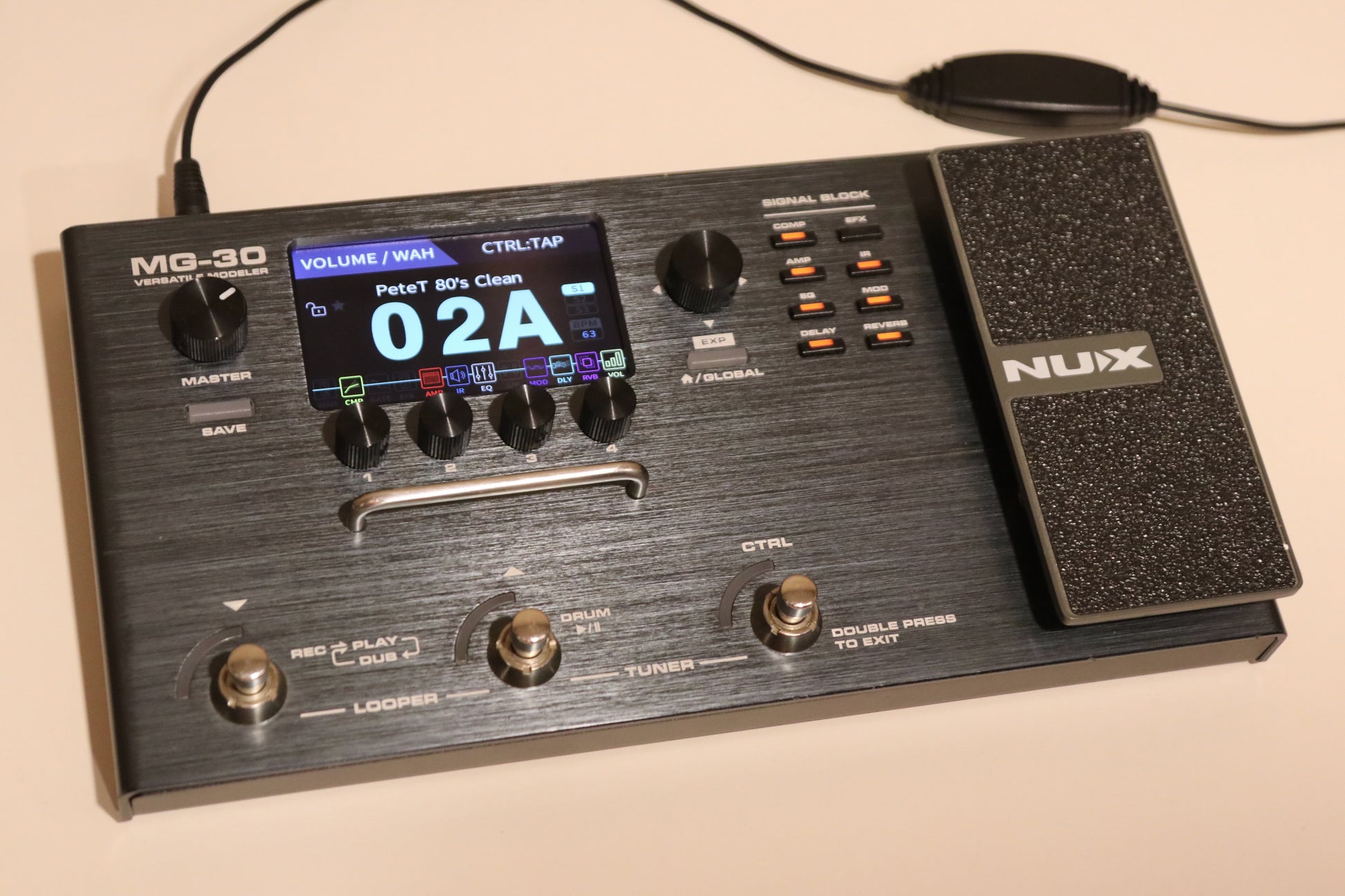 NU-X MG-30 Versatile Modeling Guitar Processor in black with display and pedal, top view