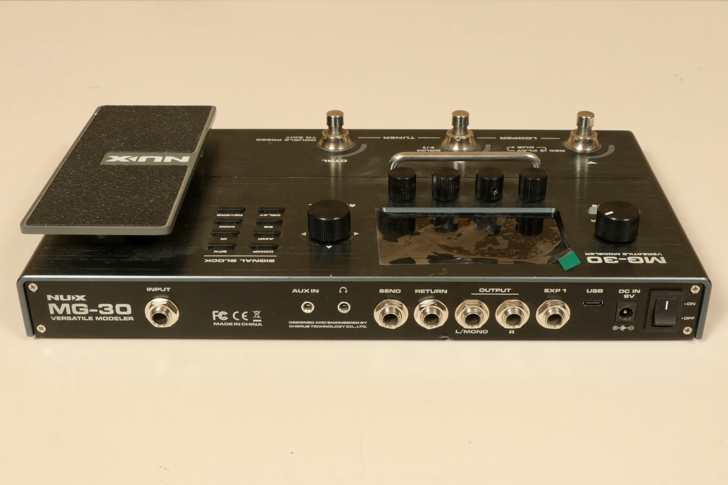 NU-X MG-30 Versatile Modeling Guitar Processor in black, top view showcasing controls and connections