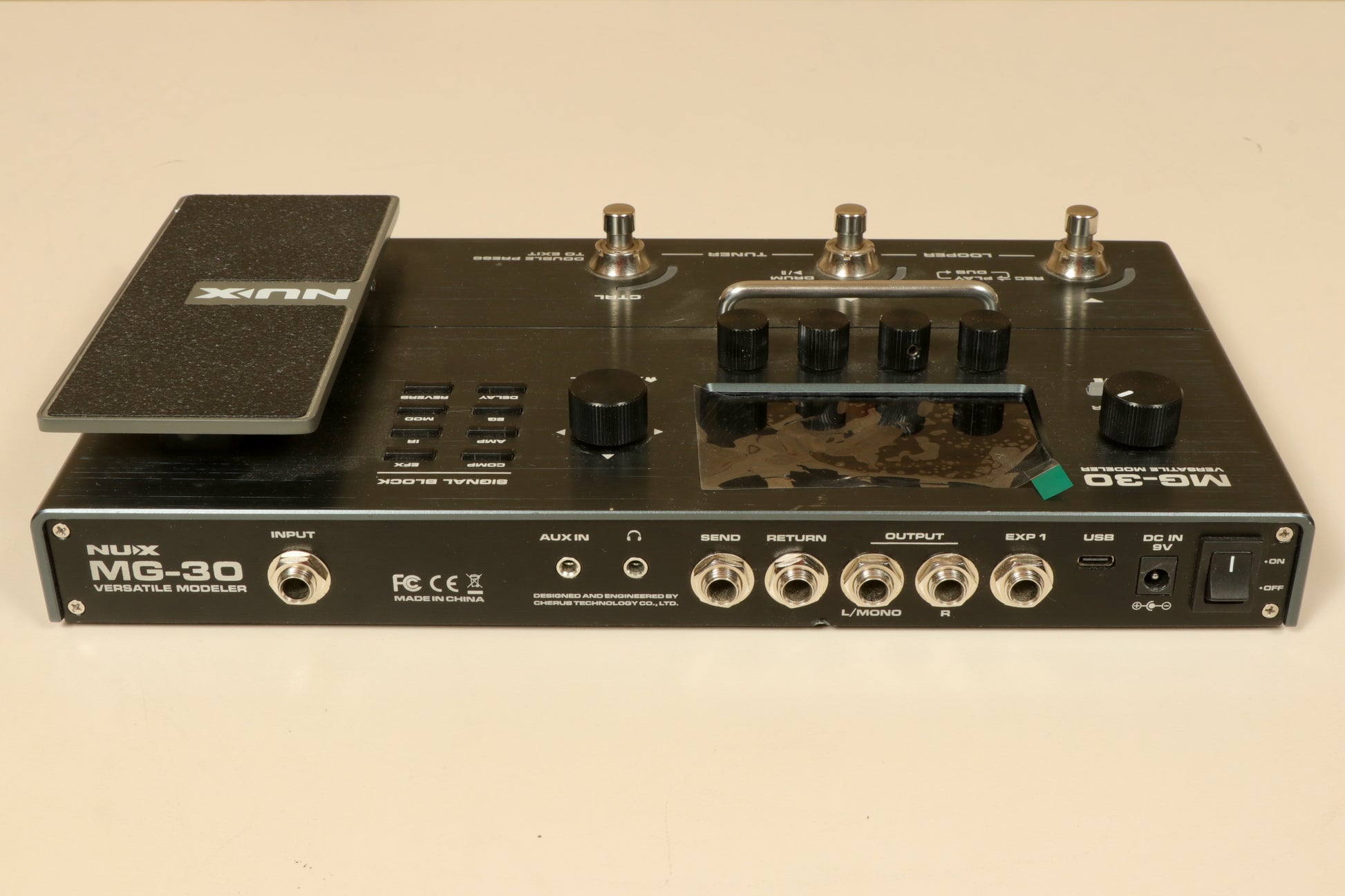 NU-X MG-30 Versatile Modeling Guitar Processor in black, top view showcasing controls and connections