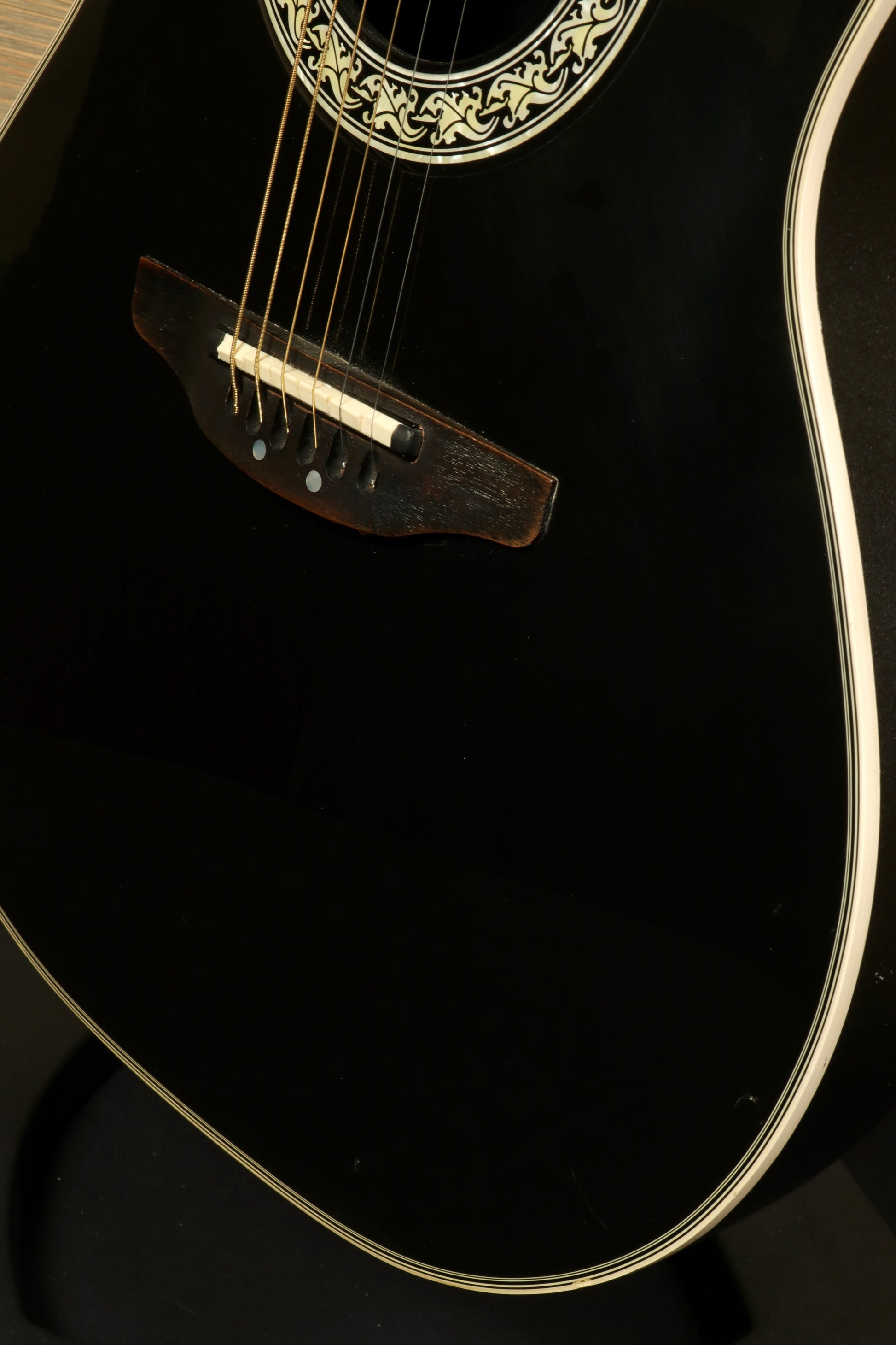 Ovation 1617 Legend with Original Hardshell Case showcasing a sleek black design and detailed rosette