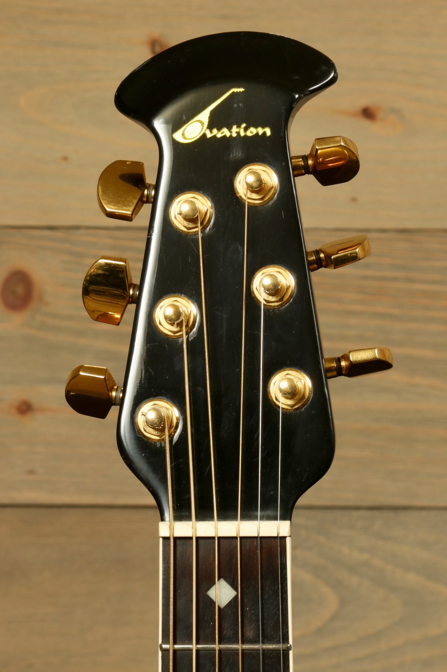 Ovation 1617 Legend with Original Hardshell Case featuring a sleek headstock and gold tuning pegs