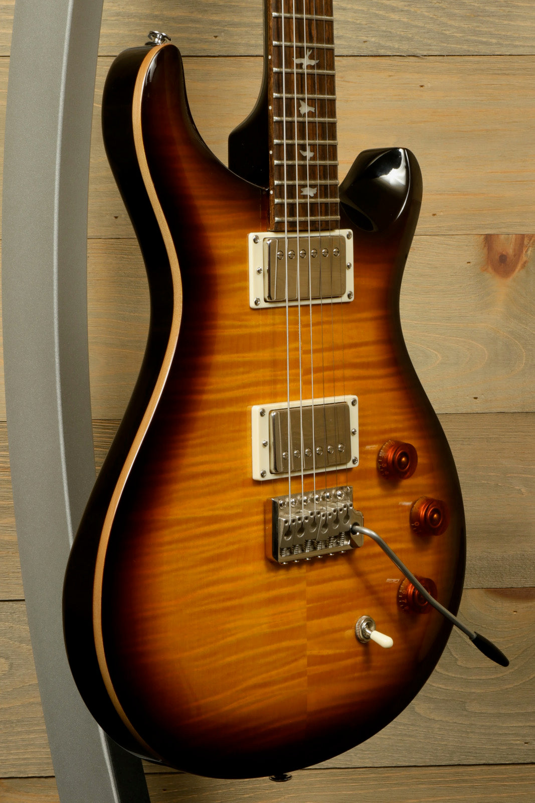 Paul Reed Smith SE DGT Sunburst Electric Guitar with PRS Gig Bag Displayed on Stand