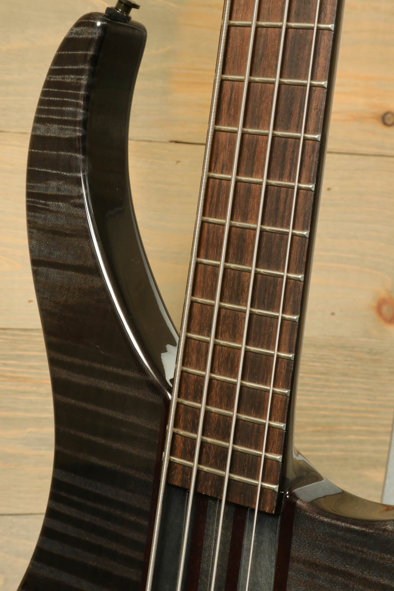 Close-up of Peavey Cirrus 4 bass guitar neck showing fretboard and strings for enhanced playability